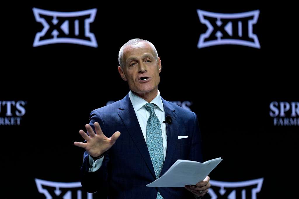 Big 12 Commissioner Brett Yormark addresses the media during the NCAA college Big 12 women's basketball media day, Oct. 22, 2024, in Kansas City, Mo. (AP Photo/Charlie Riedel, File)