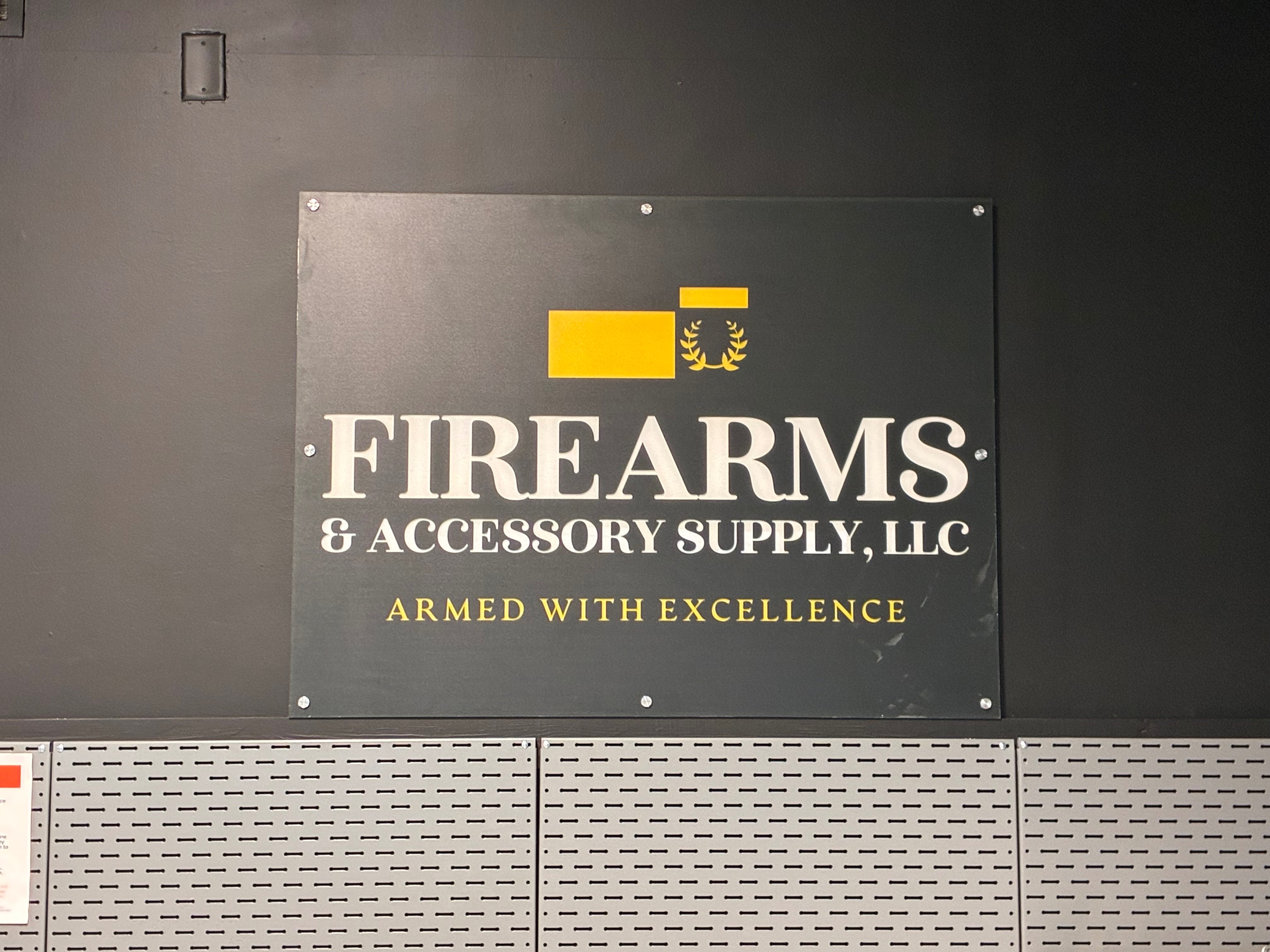The FASARMS logo is displayed inside the company's new storefront. Photo by Alin Hett/Hays Post<br>