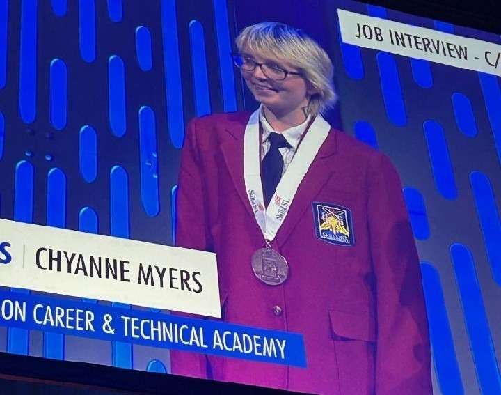 Chyanne Myers on stage with her medal. (Courtesy Photo)