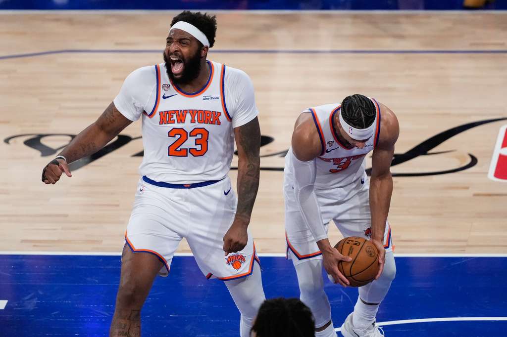 New York Knicks center Mitchell Robinson (23) and guard Josh Hart (3) celebrate after Game 4 of the NBA Finals basketball series against the San Antonio Spurs, Wednesday, June 10, 2026, in New York. (AP Photo/Ross D. Franklin)