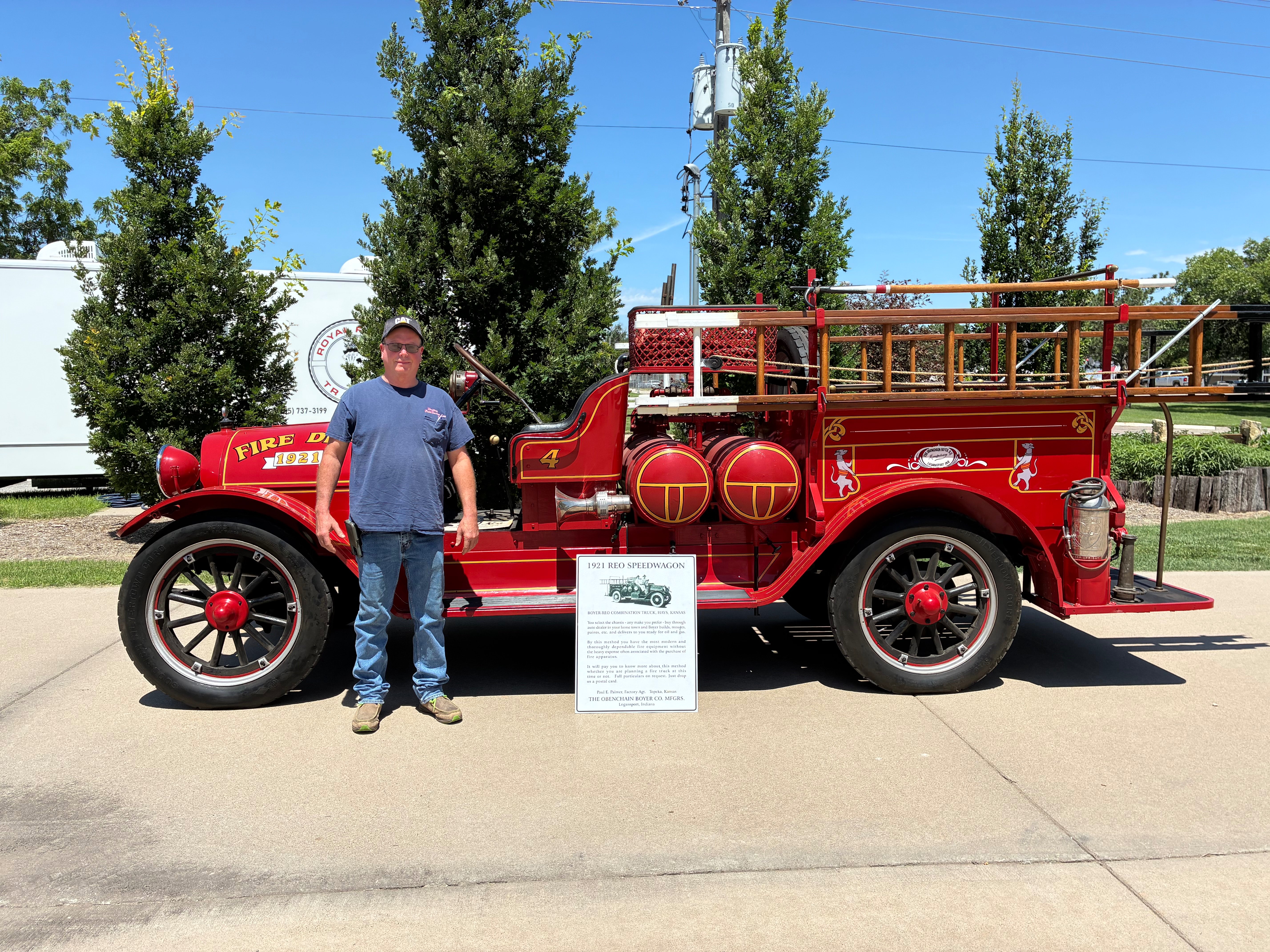 Pictured above is owner John Dreiling standing next to a 1921 fire truck, which happens to be the first motorized fire truck for the city of Hays. Photo by Alin Hett/Hays Post