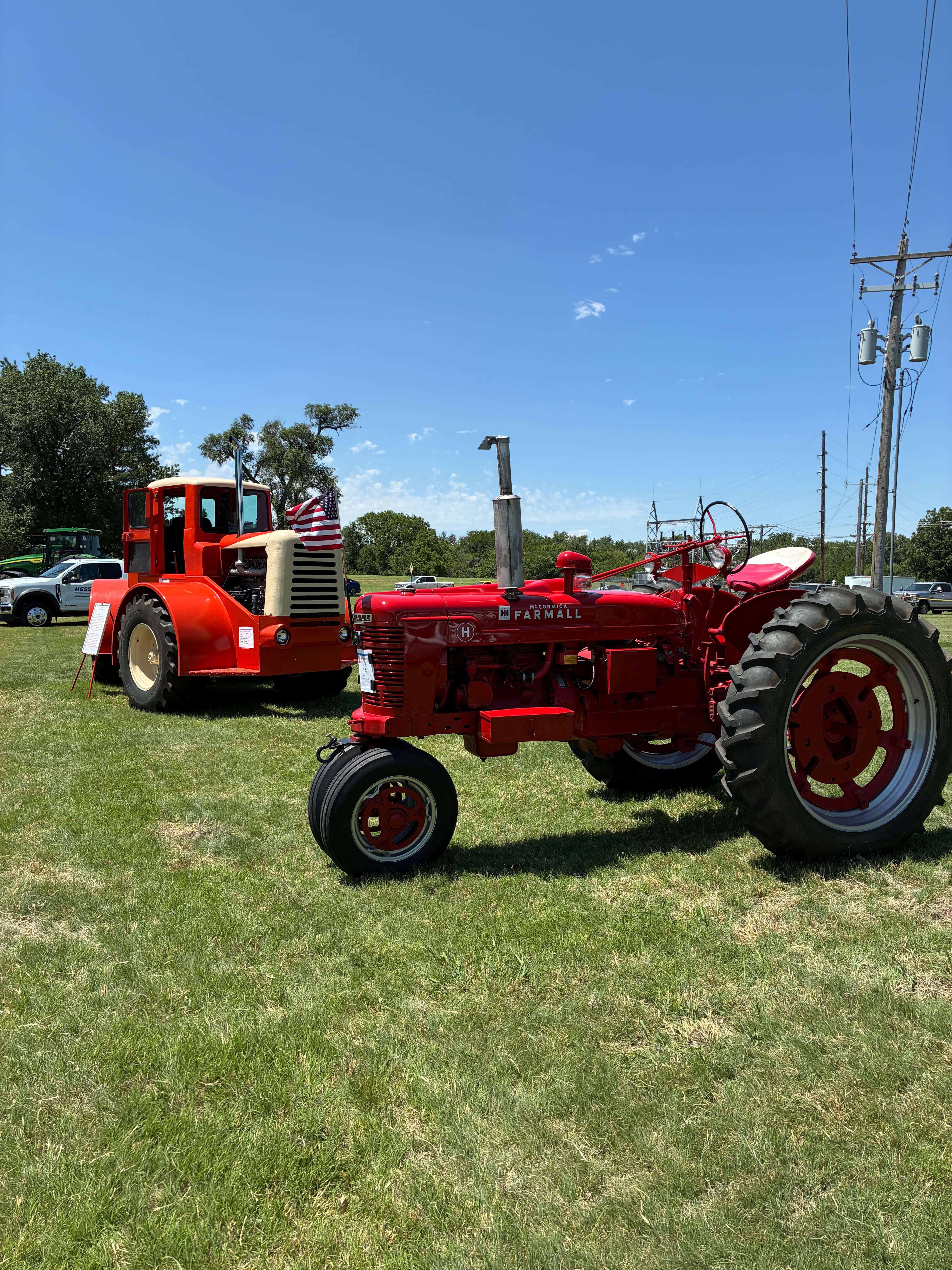 A 1954 Wagner TRD-9, left, from owner Vernon Fischer next to a 1951 International Harvester H from owner Stephen Boxler. Photo by Alin Hett/Hays Post