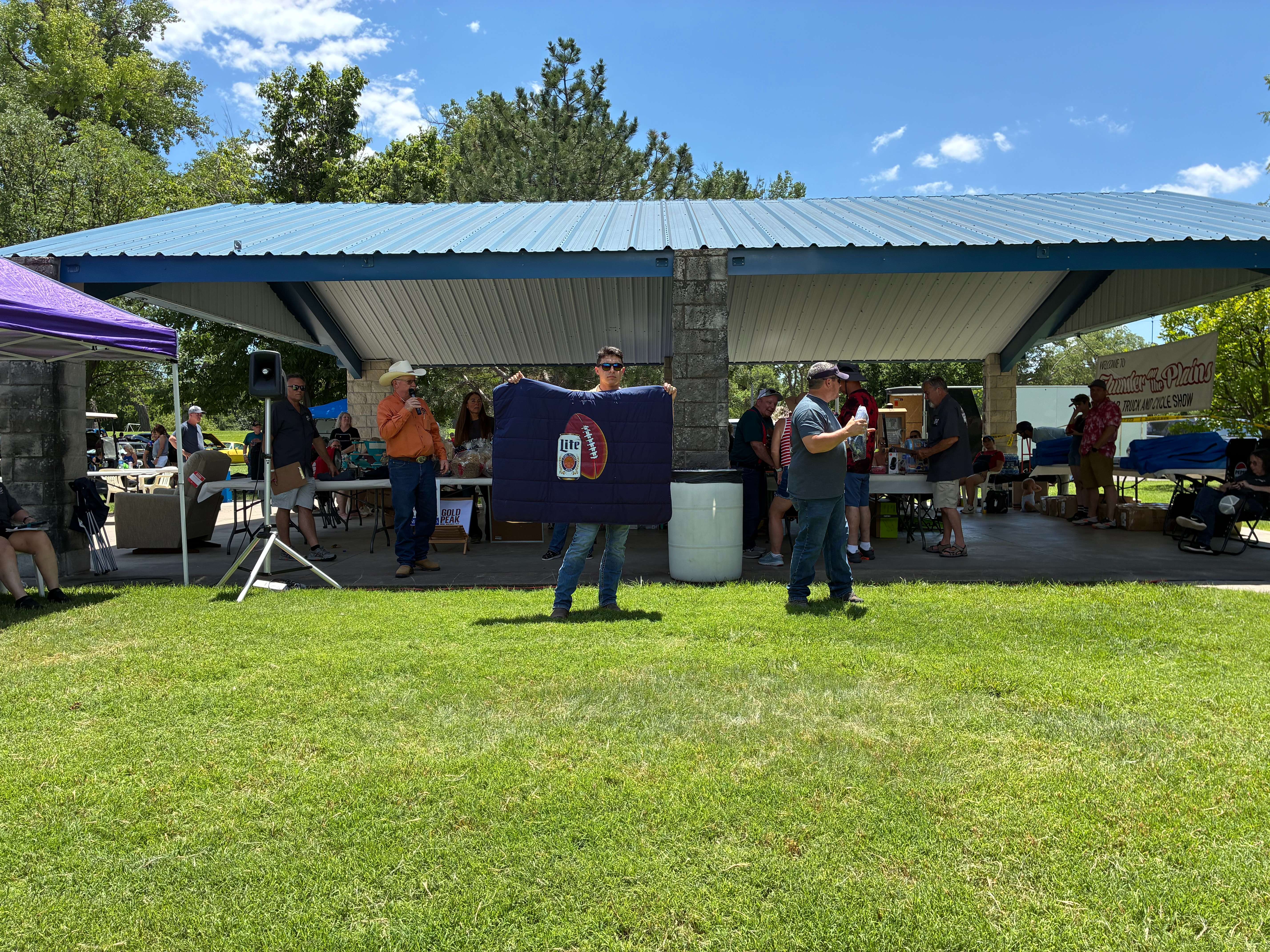 Pictured above is the auctioneer conducting the sale of one of the auction items at Thunder on the Plains 11th-annual Car, Truck and Cycle event. Photo by Alin Hett/Hays Post.