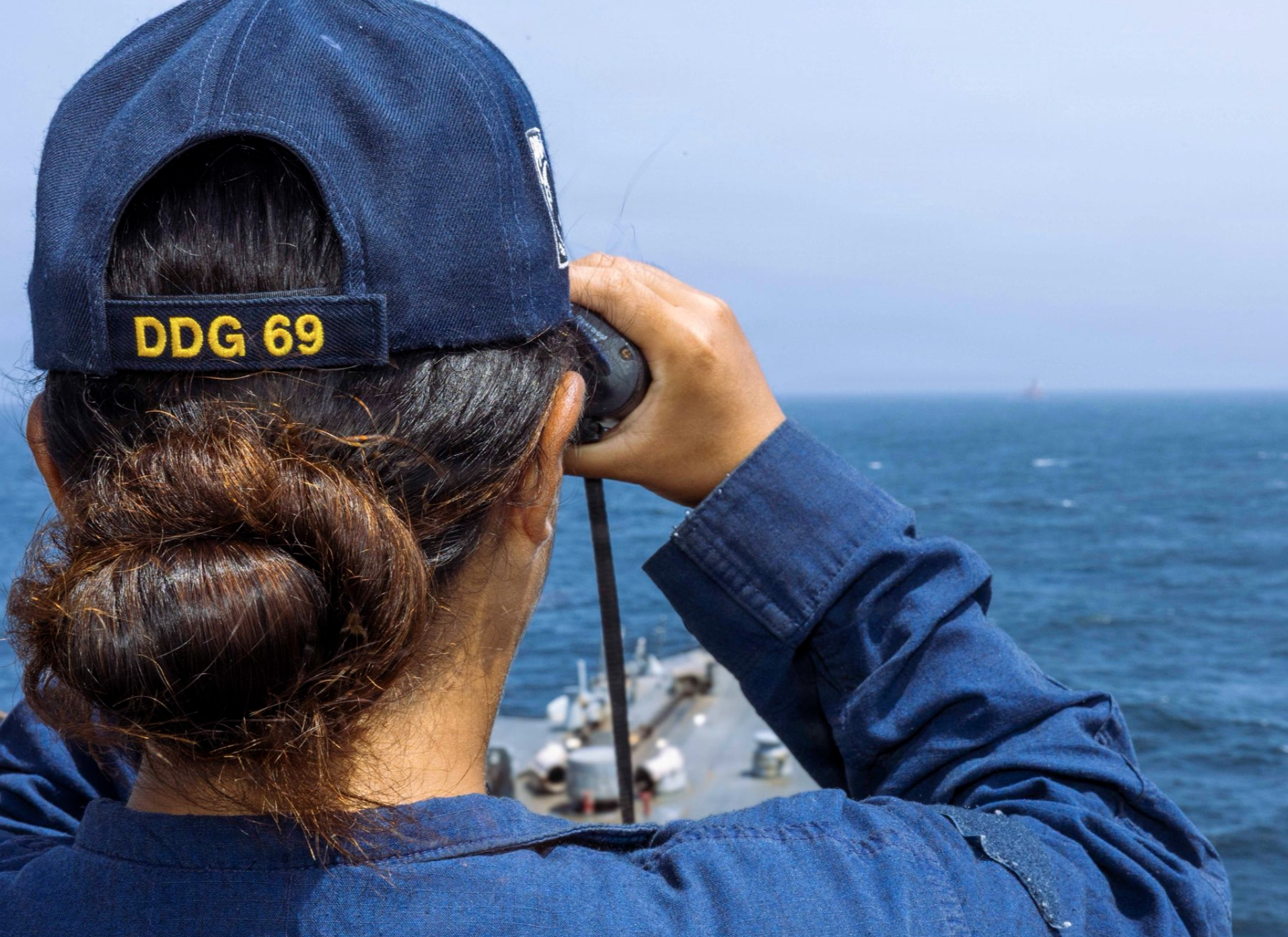 File photo A U.S Sailor aboard USS Milius (DDG 69) stands watch as the guided-missile destroyer transits regional waters supporting the U.S. blockade against Iran. As of June 14, CENTCOM forces have redirected 142 commercial ships that complied and disabled 9 vessels that did not comply.- photo U.S. Central Command