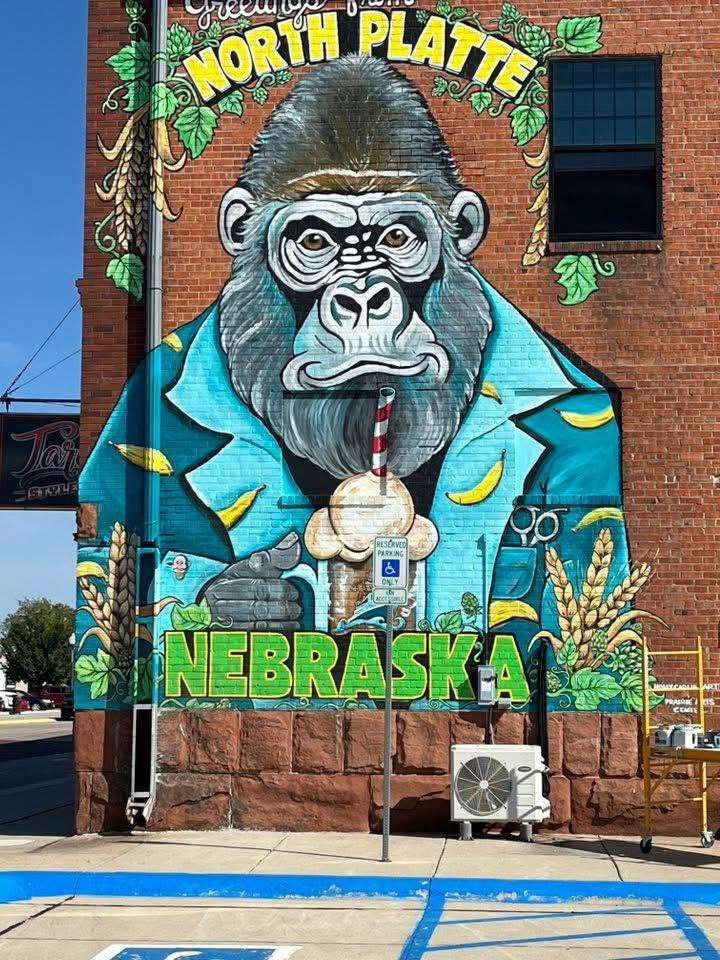 The large gorilla drinking sasparilla at ApeShip Brewing in North Platte, is the work of Carlini from 2025.