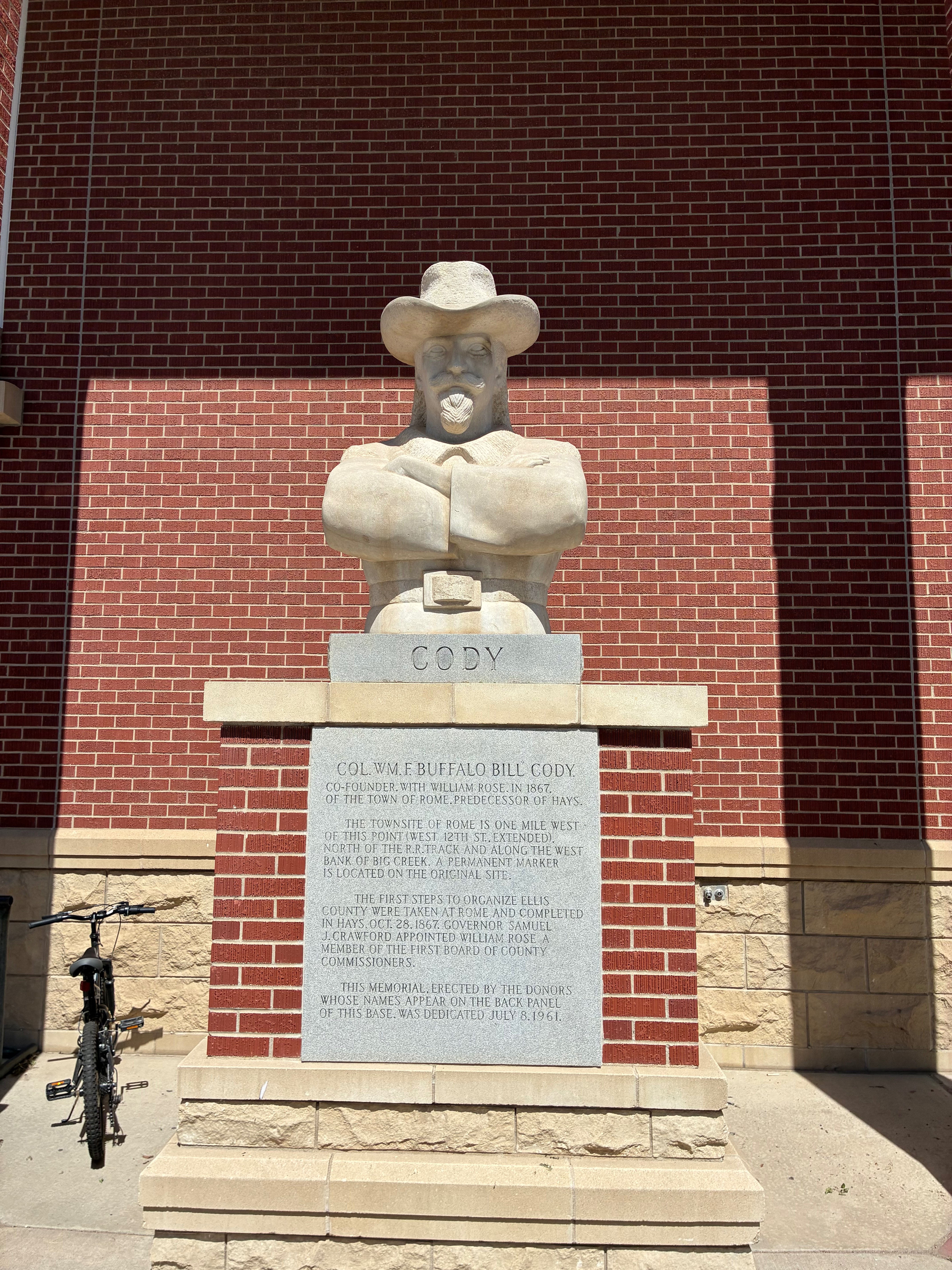 Pete Felten's 1961 limestone statue of Buffalo Bill Cody outside Hays Public Library. Photo by Alin Hett/Hays Post. 