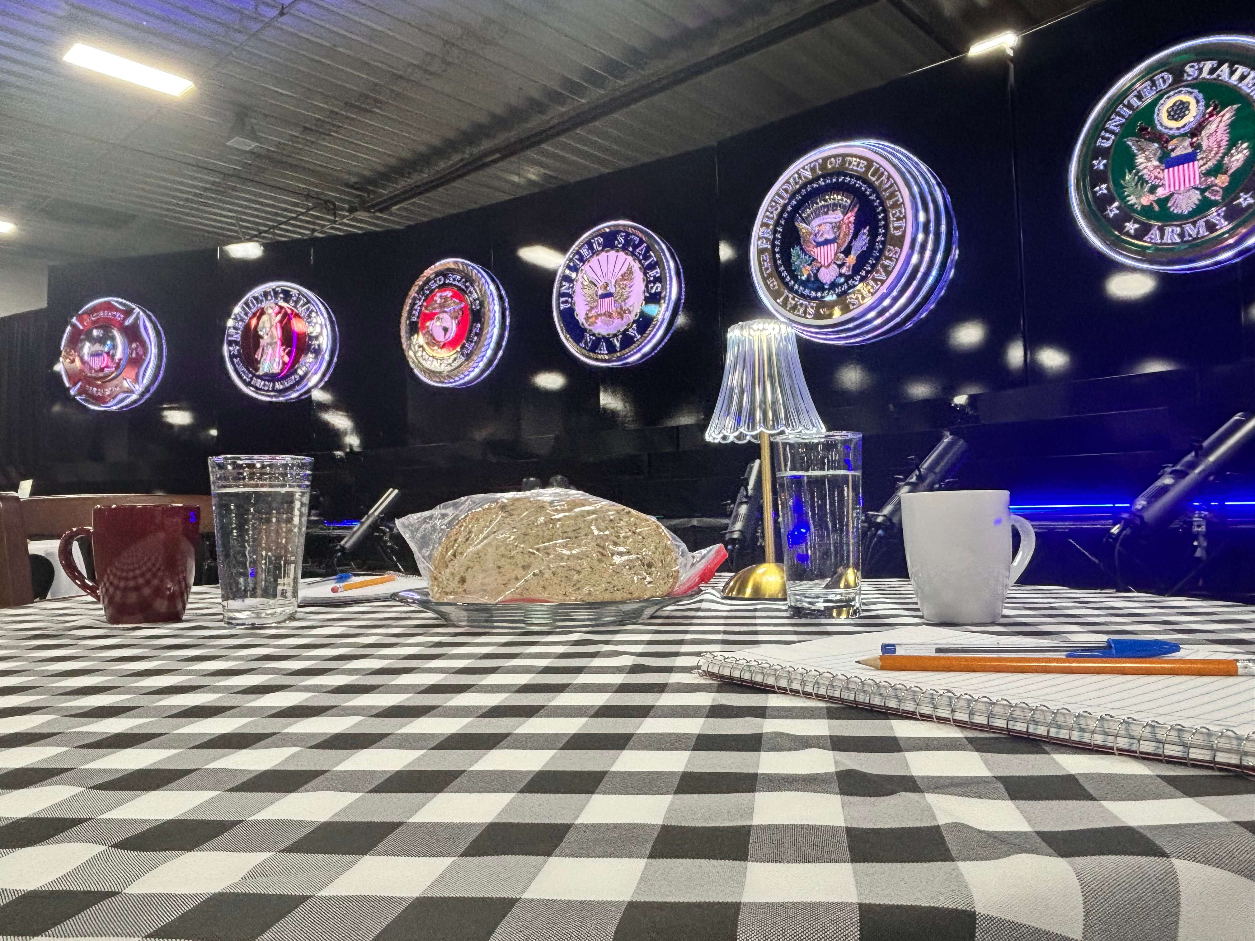 The Community Table display at Patriot Thunder's Wall of Heroes encourages respectful dialogue and the sharing of ideas among people with differing viewpoints. The exhibit uses symbolic displays alongside a multimedia presentation focused on patriotism, service and civic engagement. (Allison Peck | The Post)