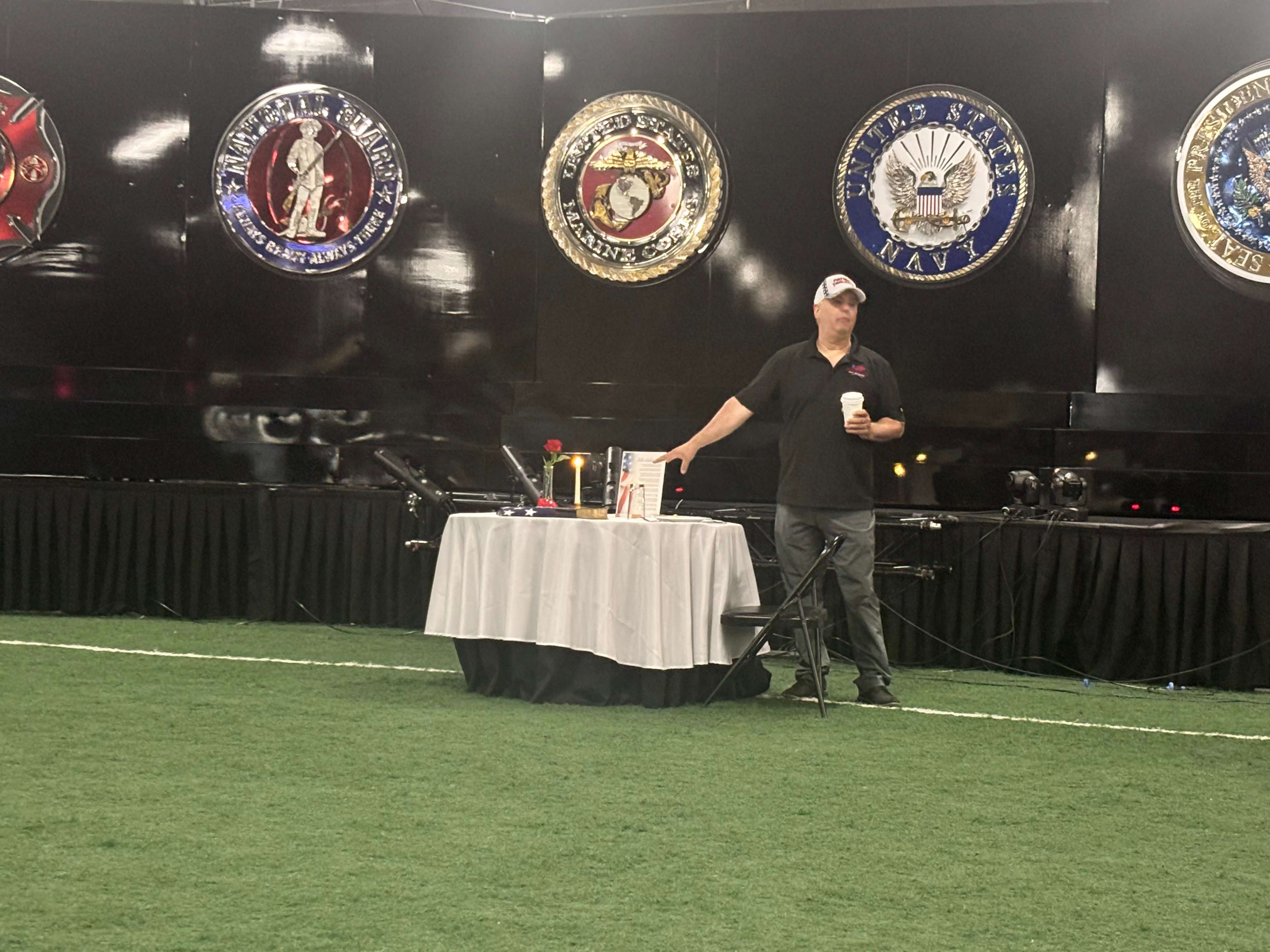 Patriot Thunder Designer Tim Ambrose discusses the symbolism behind one of the exhibit's displays during a presentation in North Platte. Organizers say the Wall of Heroes is designed to honor service members while inspiring patriotism and civic responsibility. (Allison Peck | The Post)