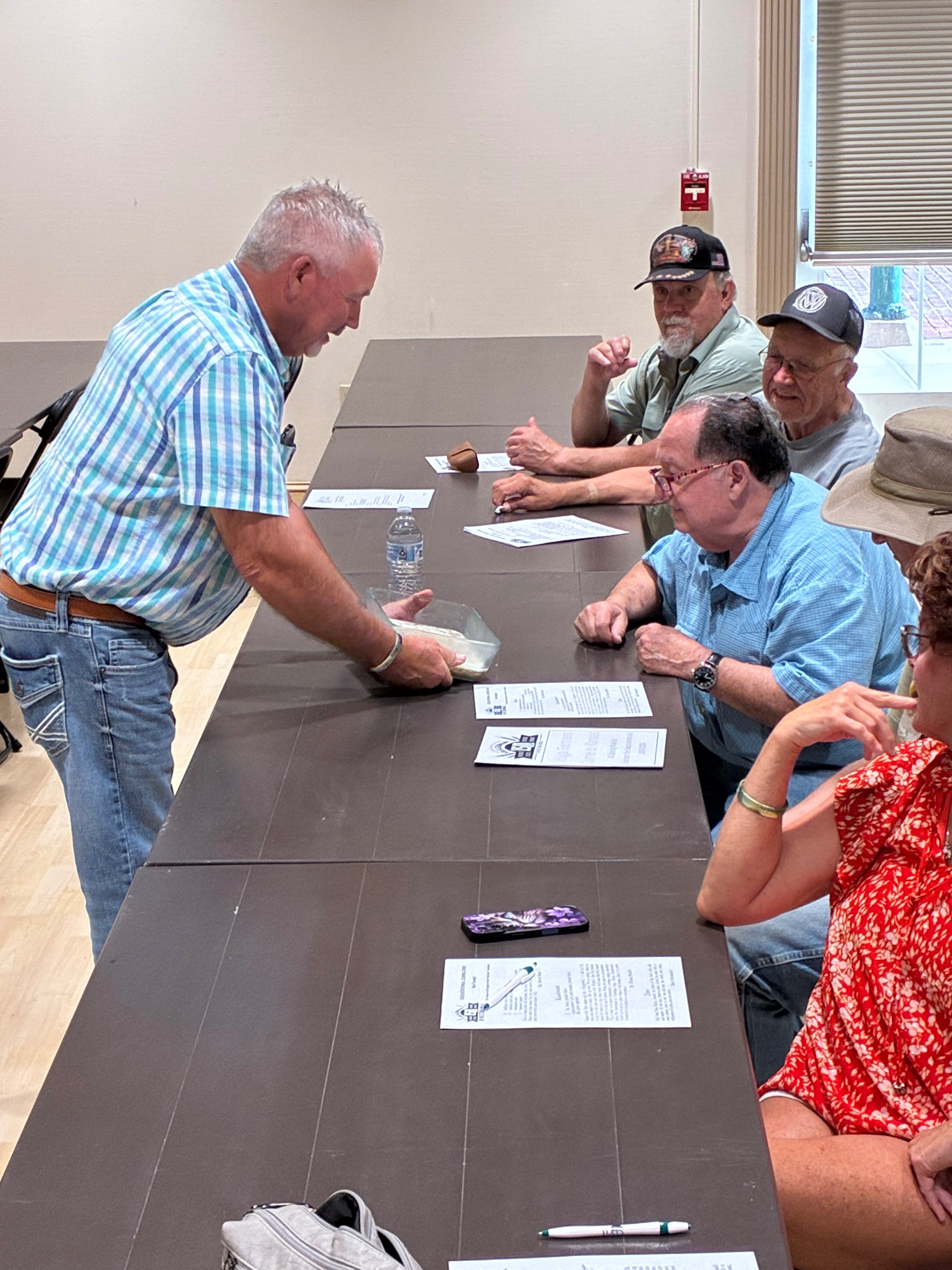 Neal Younger shows attendees his homemade galrei during the Sesquicentennial Cooking Demonstration hosted by the Ellis County Historical Society. Photo by Alin Hett/Hays Post&nbsp;