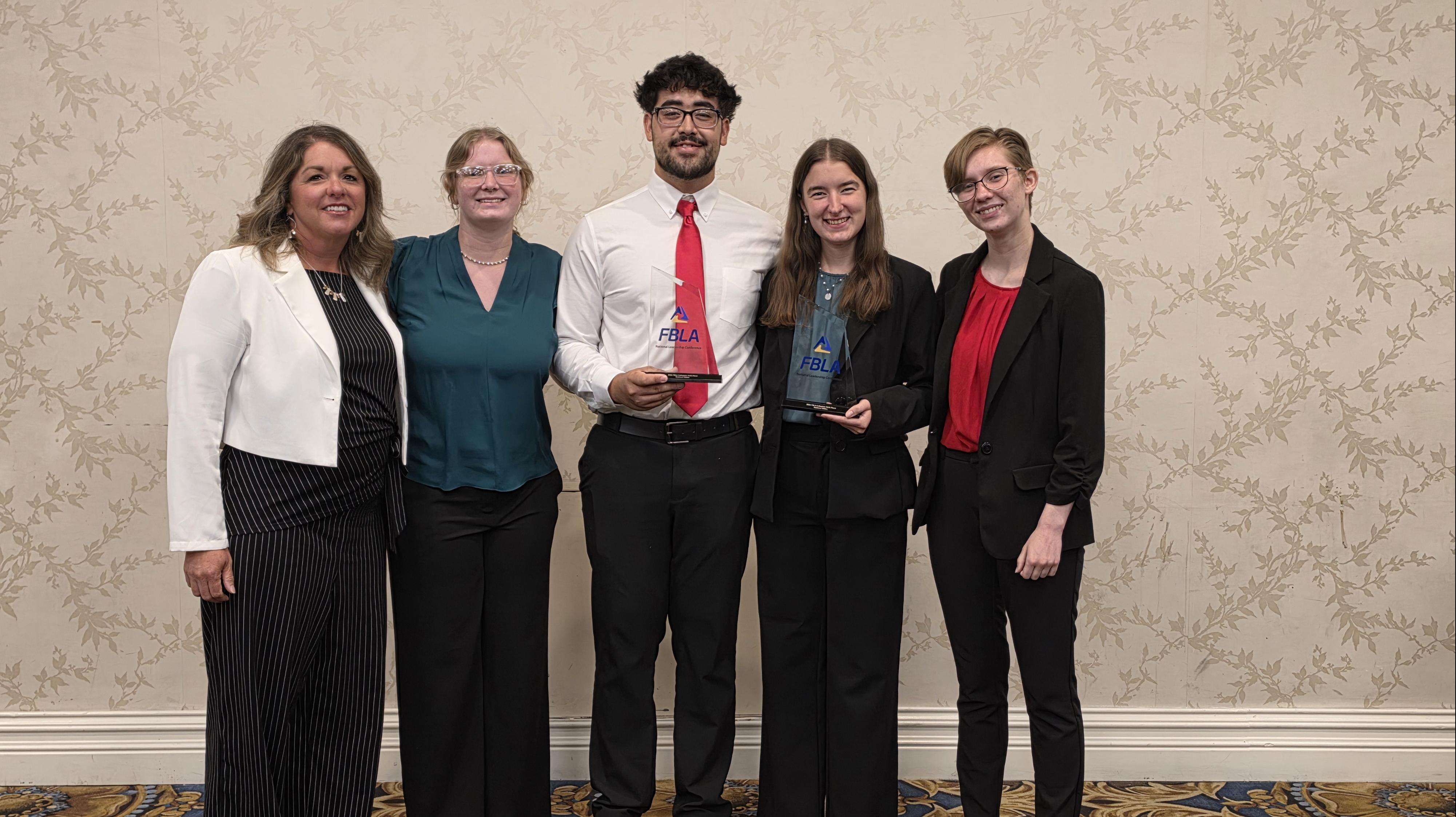 (From left) Barton Business Instructor Jennifer Steinert, Barton Business students Katelin Ritchie, David Dominguez, Rose Timmermeyer, and Audrey Rey pause for a photo at the National Collegiate Future Business Leaders of America Leadership Conference and Competition, June 6-8 in Las Vegas.