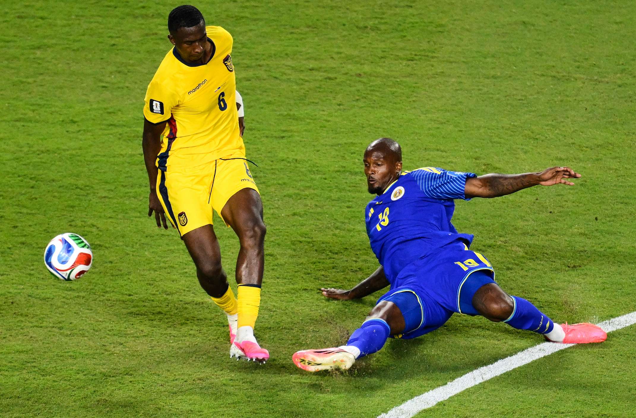 Curaçao's Gervane Kastaneer (19) and Ecuador's Willian Pacho (6) battle for the ball during the World Cup Group E soccer match between Ecuador and Curacao in Kansas City, Mo., Saturday, June 20, 2026. (AP Photo/Reed Hoffmann)