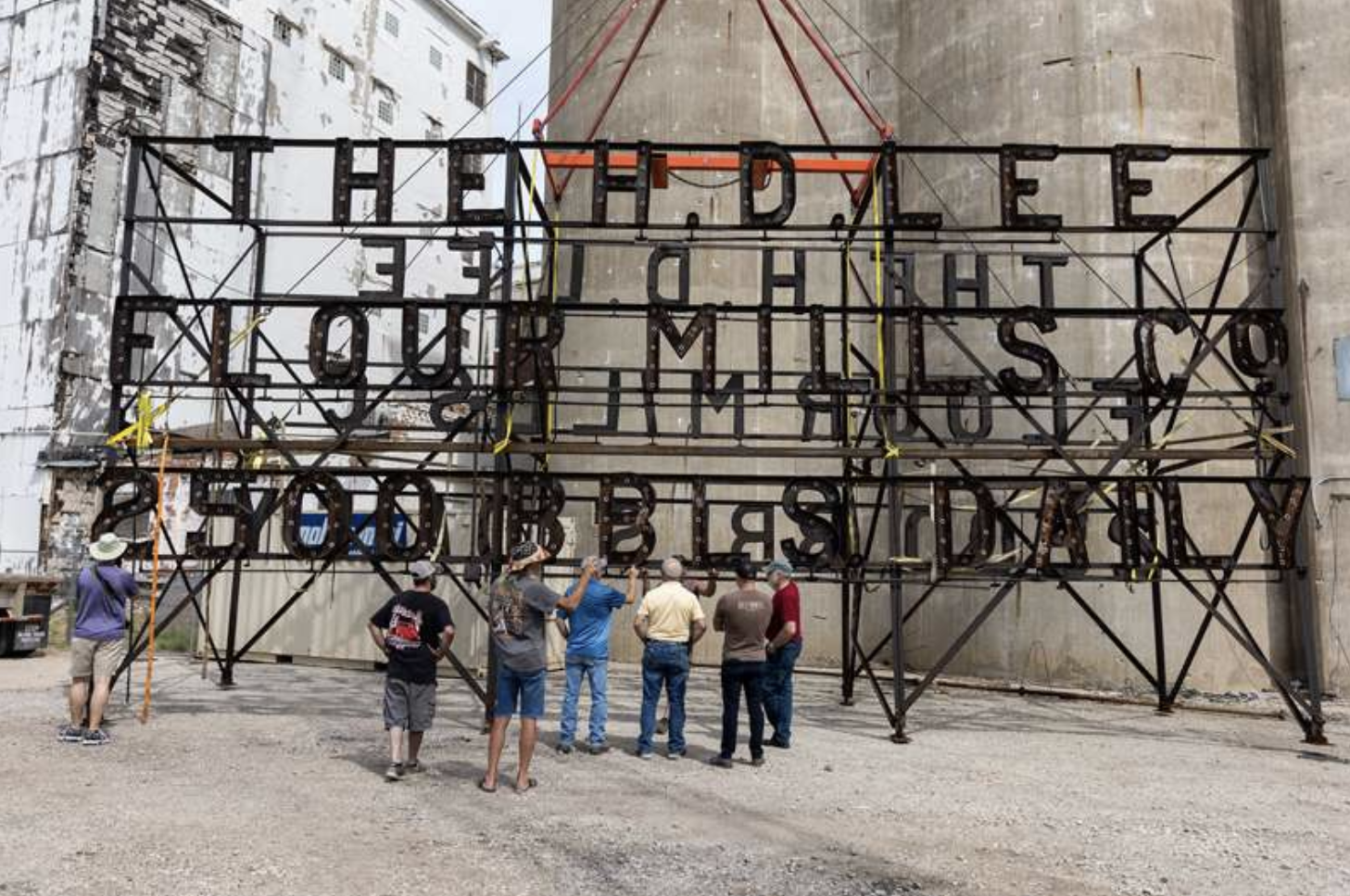 The H.D. Lee sign rests on the ground after being removed from the top of the old mill back in August 2021. Photo courtesy Tanner Colvin/ Vortex Companies