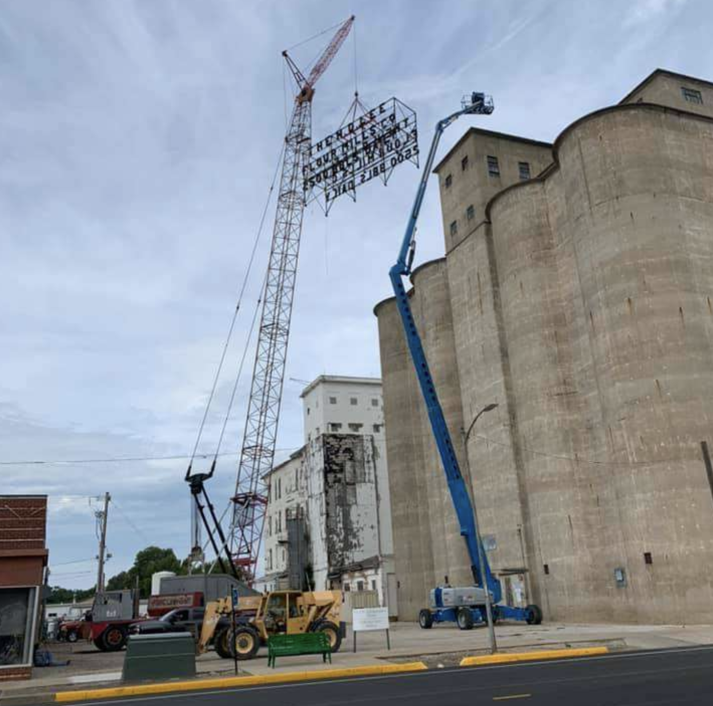A crane removes the sign from the old mill. Photo courtesy Tanner Colvin/ Vortex Companies