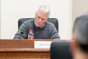 Commissioner Jim Elworth, who serves on the Nebraska Medical Cannabis Commission and Nebraska Liquor Control Commission, listens to public comment during a hearing on proposed medical cannabis rules and regulations set by the overarching commission. Feb. 26, 2026. (Zach Wendling/Nebraska Examiner)