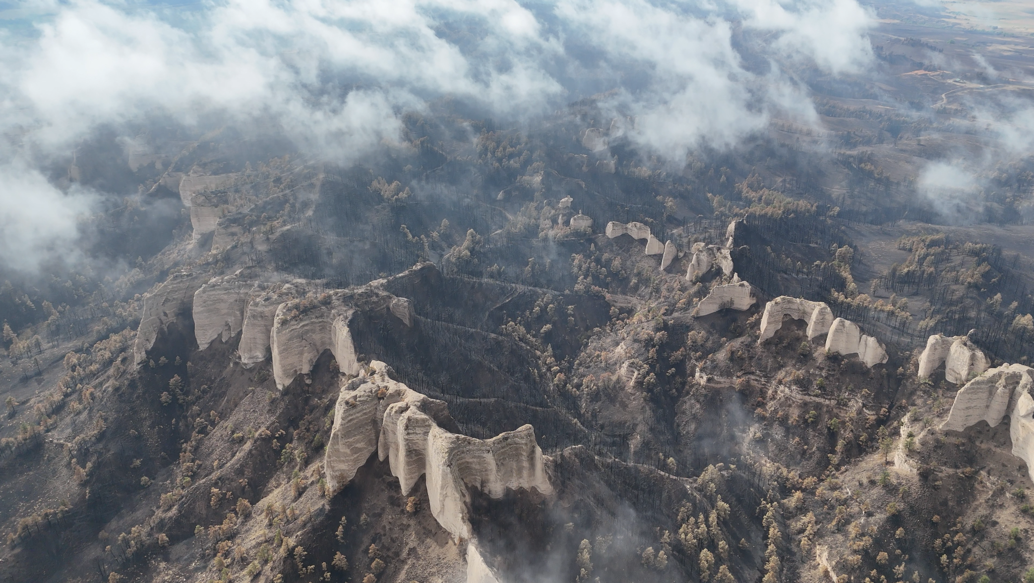 <i>Fort Robinson State Park's iconic butte range, stands below sparse clouds.- US Forest Service Photo</i>