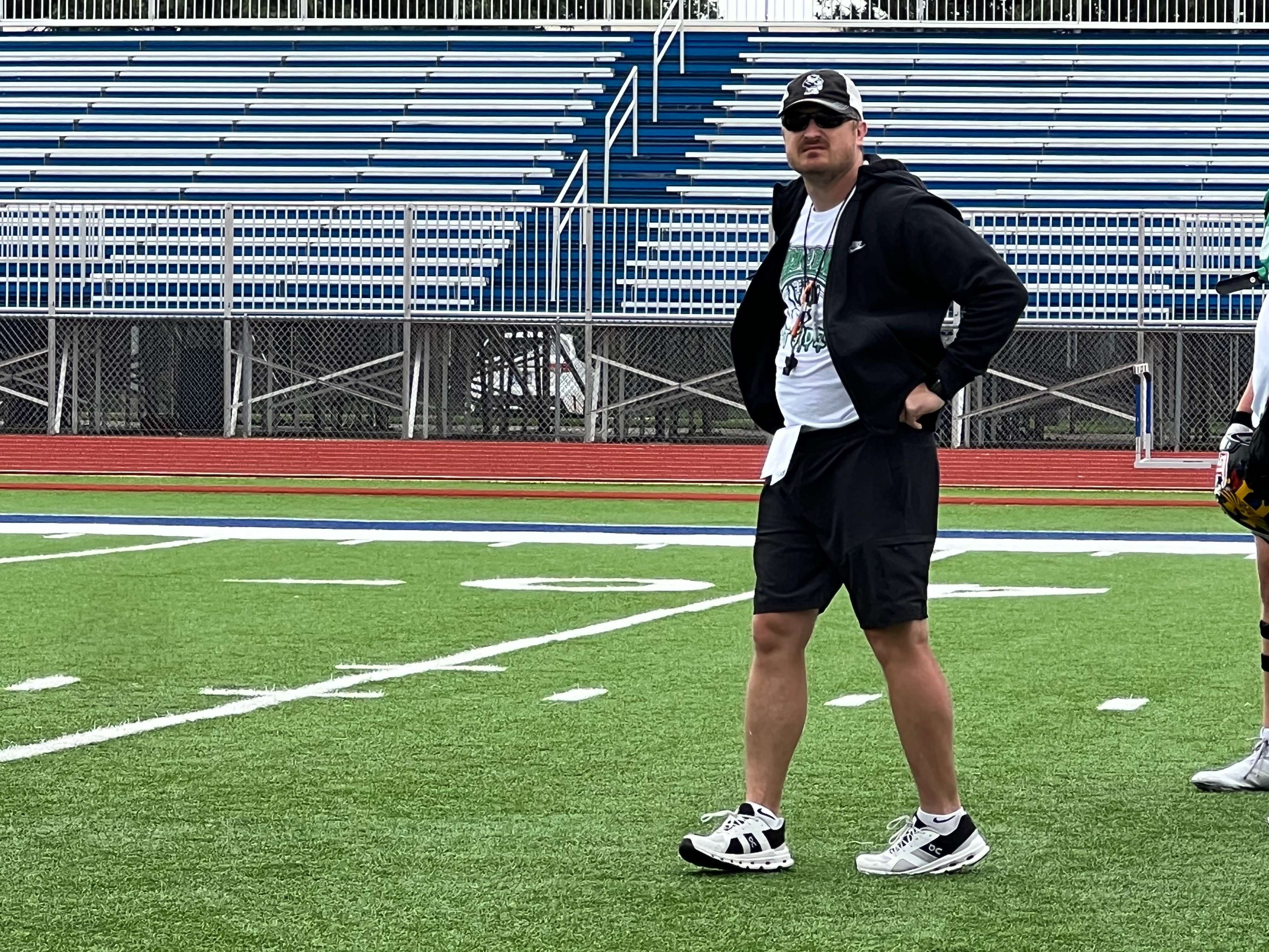 Sterling head coach Brent Schneider watches practice during Kansas Shrine Bowl West Team camp Tuesday, June 23, 2026, at Gowans Stadium in Hutchinson, Kan. Schneider is serving as an assistant coach for the West Team. (Hutch Post Photo/Sean Boston)
