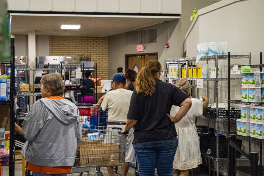 People shop the shelves at the Ritenour Co-Care Food Pantry just outside of St. Louis last week. The nonprofit has seen rising need as grocery prices soar and thousands of Missourians lose federal food assistance. (Photo by Ritenour Co-Care Food Pantry), Courtesy photo<br>