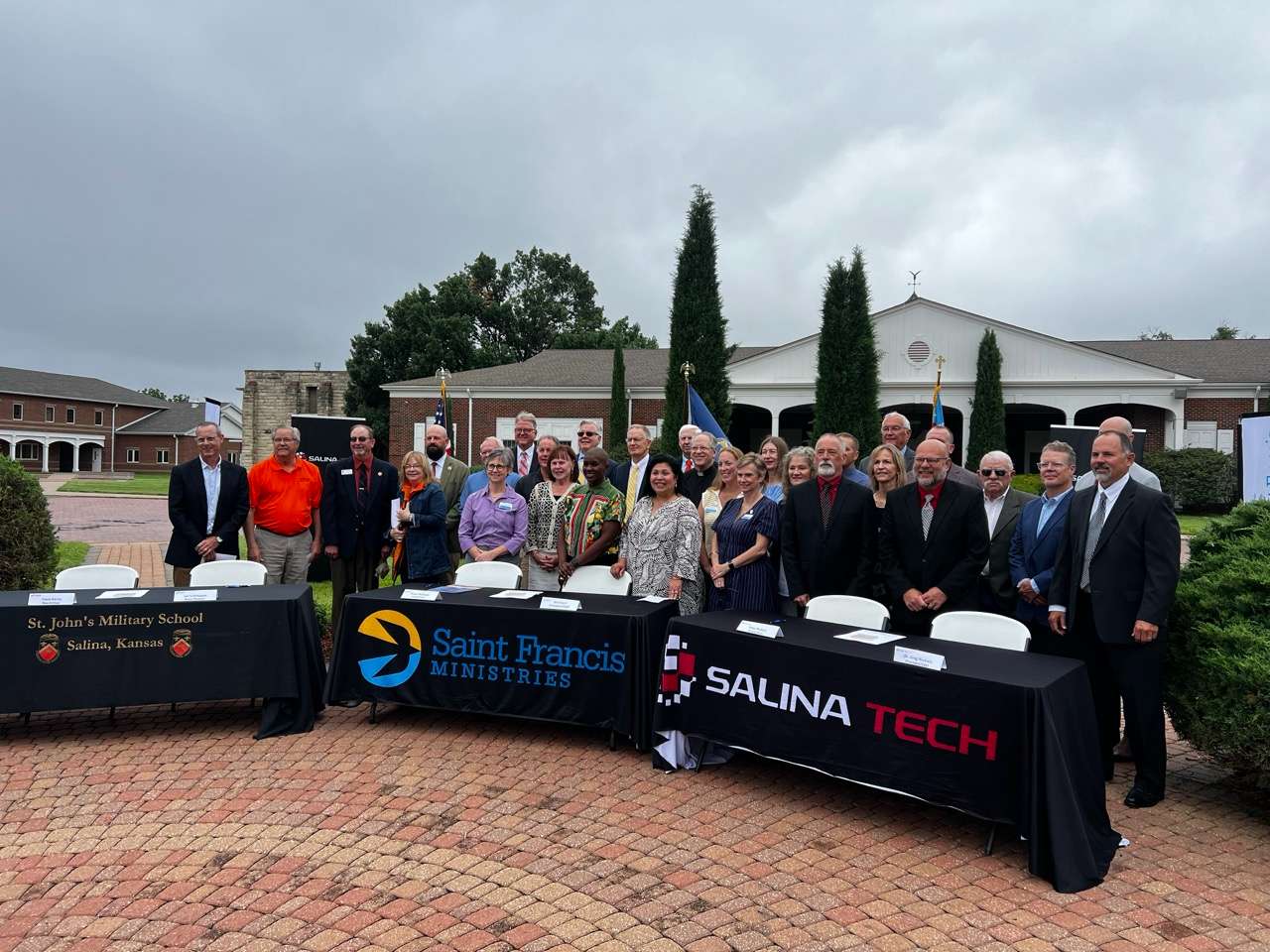 Board members and staff of St. John's Military School Historical Museum, Saint Francis Ministries and Salina Area Technical College celebrate signing ceremony on Friday, June 26 - Photo, Nicolas Fierro 