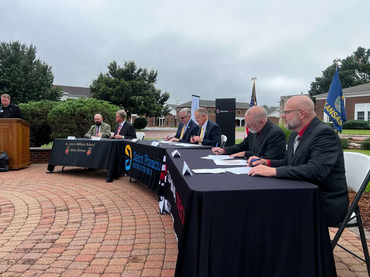 St. John's Military School Historical Museum, Saint Francis Ministries and Salina Area Technical College put pen to paper during the signing ceremony.&nbsp;<b>From left to right:&nbsp;</b><b>St. John's Military School Historical Museum:</b>&nbsp;Kevin Kerns, Board Chair, Larry Britegam, Board Member \&nbsp;<b>Saint Francis Ministries:&nbsp;</b>Rev. Brock Slabach, Board Chair, William "Bill" Clark, President/CEO \&nbsp;<b>Salina Area Technical College:</b>&nbsp;Mike McCall, Board Chair, Dr. Greg Nichols, President/CEO - Photo, Nicolas Fierro
