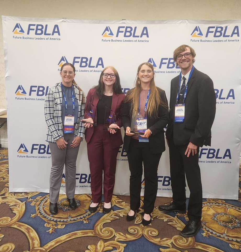 Chadron State College students pose at the FBLA Collegiate National Leadership Conference (NLC) in Las Vegas June 6-8, 2026. From left, Abigail Russell of Hay Springs, Neb., Alana Wheatly of Gothenburg, Neb., Mekenna Fisher of Hershey, Neb., and Justin Johnson of Broken Bow, Neb. (Courtesy photo, used with permission)