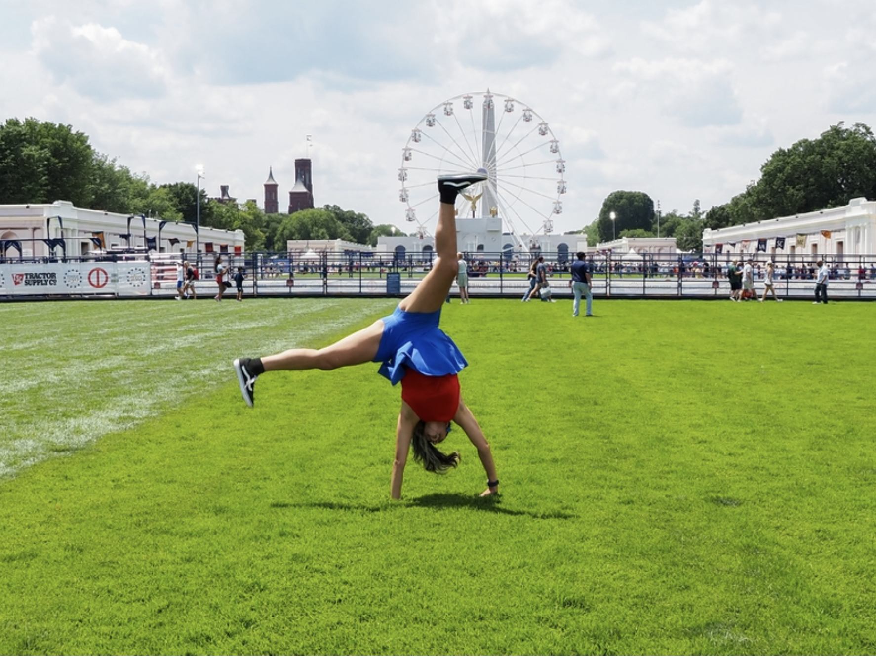 Tanya Geders, 43, of St. Louis, Missouri, modeled a cartwheel for her son on the National Mall at the Freedom 250 Great American State Fair on Thursday, June 25, 2026. (Photo by Ashley Murray/States Newsroom)