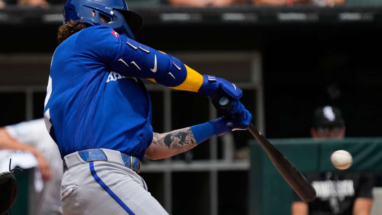 Kansas City Royals' Carter Jensen hits a one-run single during the first inning of a baseball game against the Chicago White Sox in Chicago, Sunday, June 28, 2026. (AP Photo/Nam Y. Huh)