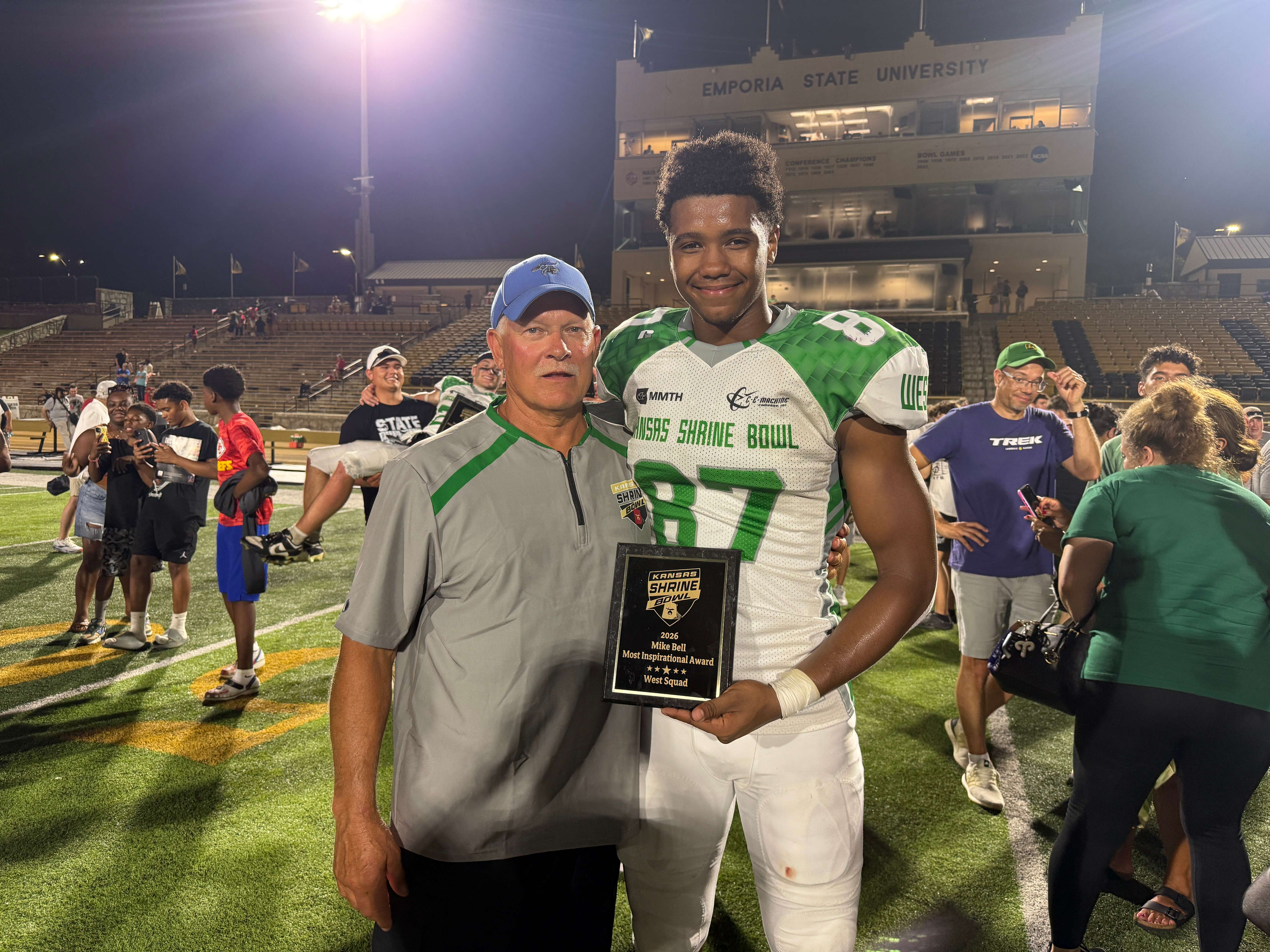 Junction City Head Football Coach Randall Zimmerman and recent JCHS graduate Jackson Hollie after the 53rd Kansas Shrine Bowl at Welch Stadium in Emporia.&nbsp;(Photo Callie Jones)