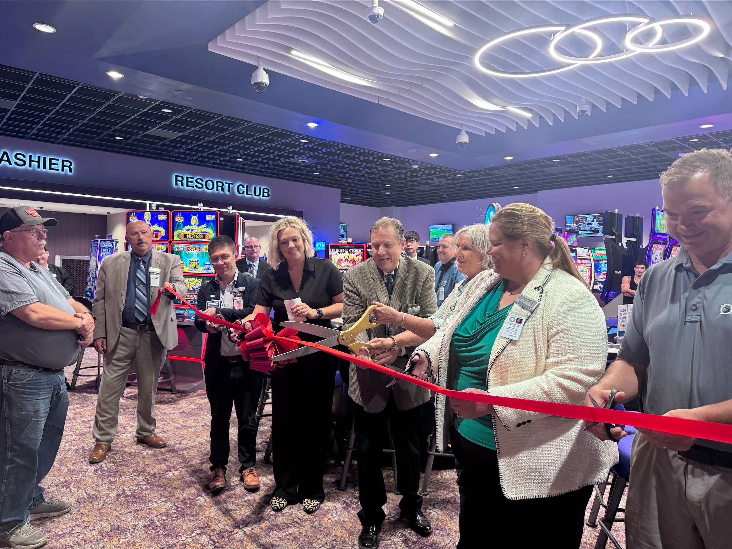 Officials with Lake Mac Casino Resort &amp; Racetrack, Elite Casino Resorts, the Nebraska Racing and Gaming Commission, and local business leaders cut the ribbon Tuesday, June 30, celebrating the opening of live table games at the Ogallala casino. (Carla Beck | The Post)