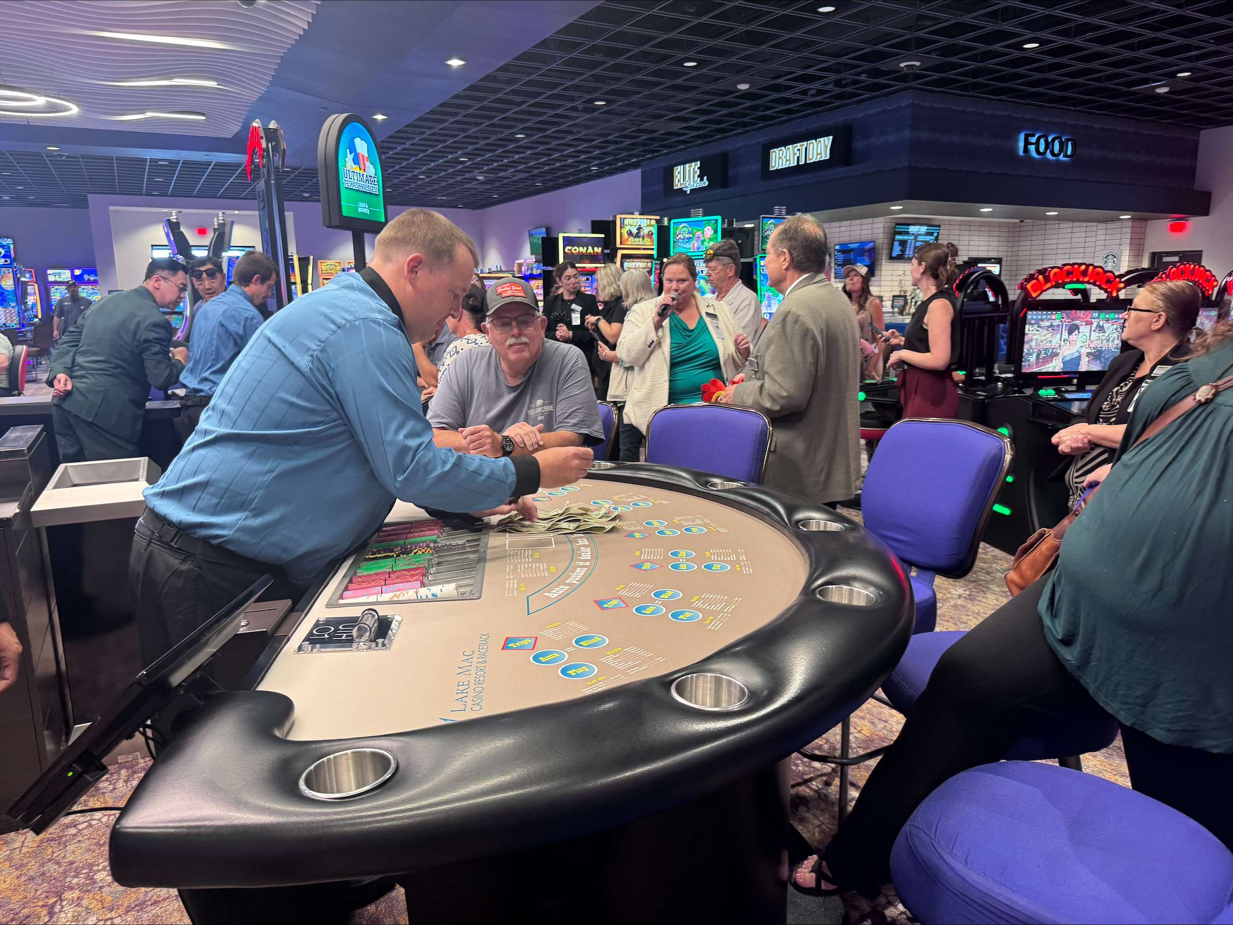 A dealer demonstrates one of Lake Mac Casino Resort &amp; Racetrack's new live Blackjack tables following Tuesday's ribbon cutting ceremony. Live Blackjack and Ultimate Texas Hold'em officially open to the public July 2. (Carla Beck | The Post)