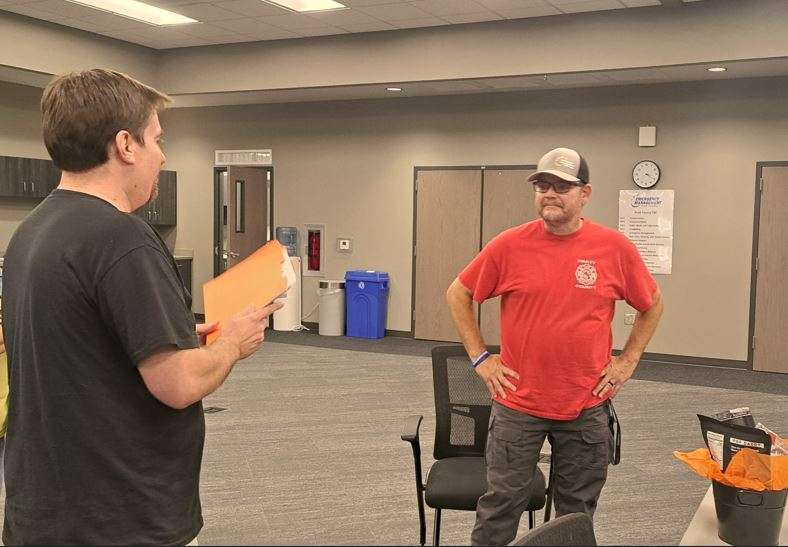 Shaphan Staats, chaplain with Pratt County Fire and Rescue, receives the June First Responder of the Month award from Daren Dunn with Eagle Media. The award is presented by Eagle Media and PrairieStar Health Center. (Hutch Post Photo)