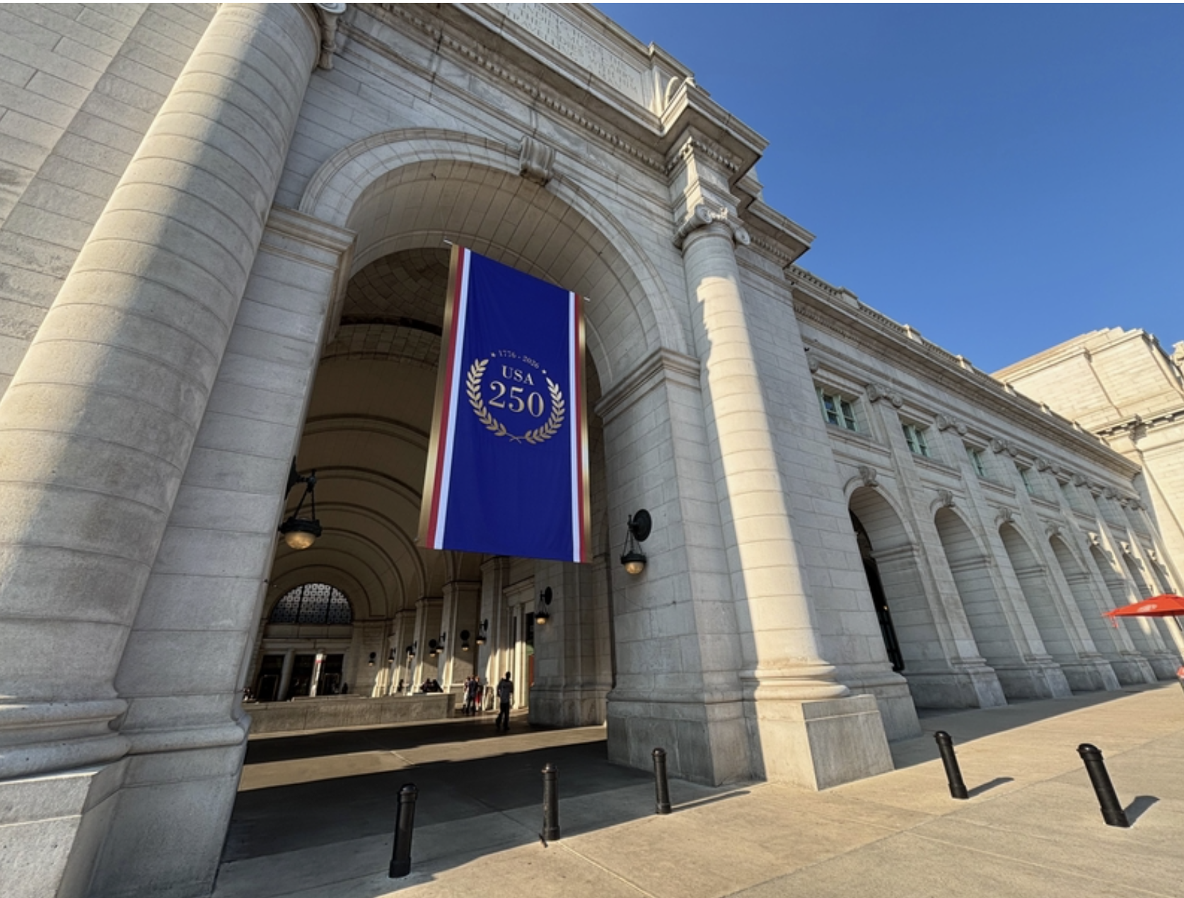 A 250th anniversary flag hangs in an entryway at Union Station in Washington, D.C., on June 29, 2026. (Photo by Jane Norman/States Newsroom)