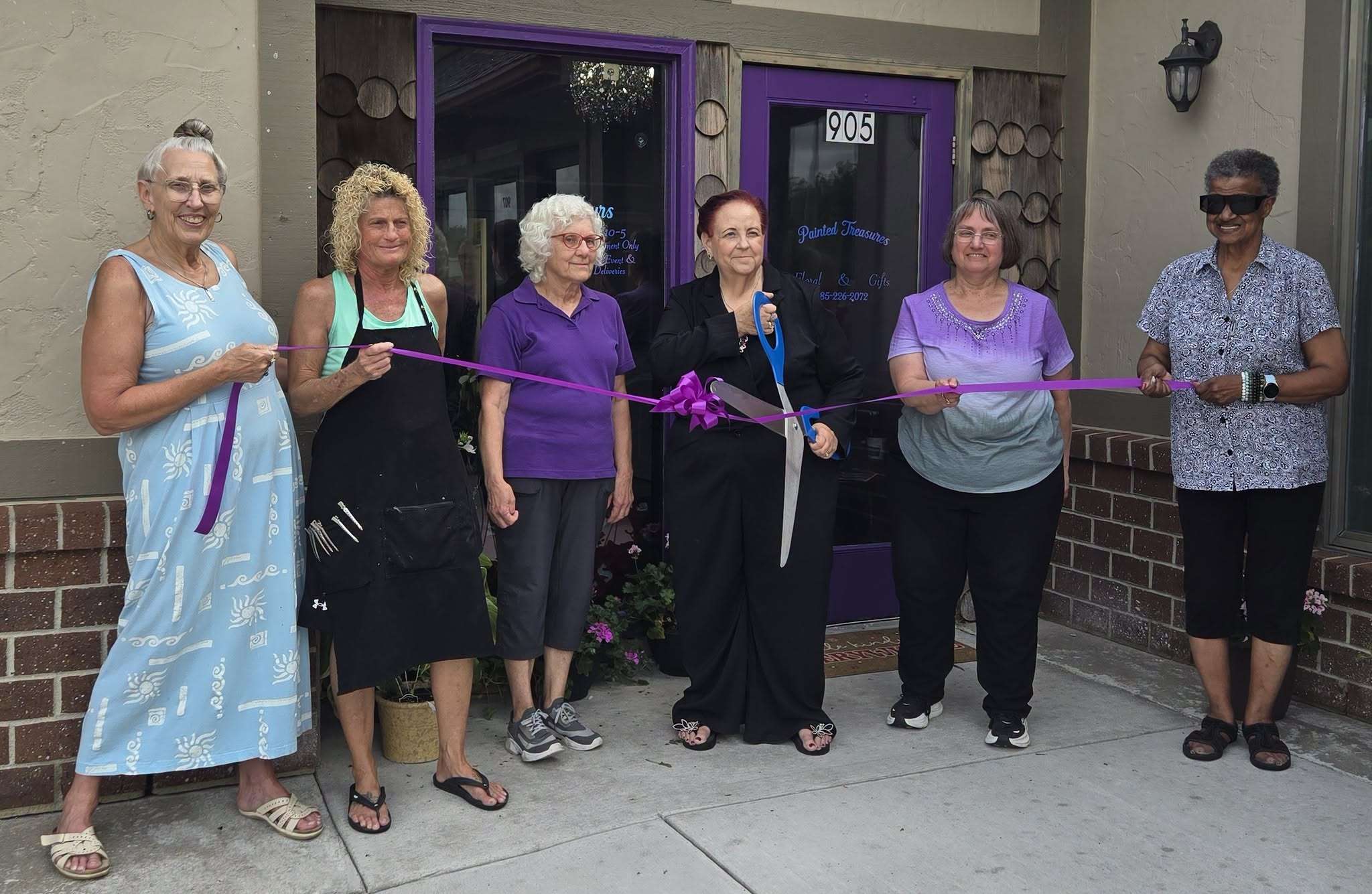 Ribbon-cutting to officially open Painted Treasures Floral & Gifts. Grand opening event was held on June 26 in Junction City at 905 W. 6th Street. 