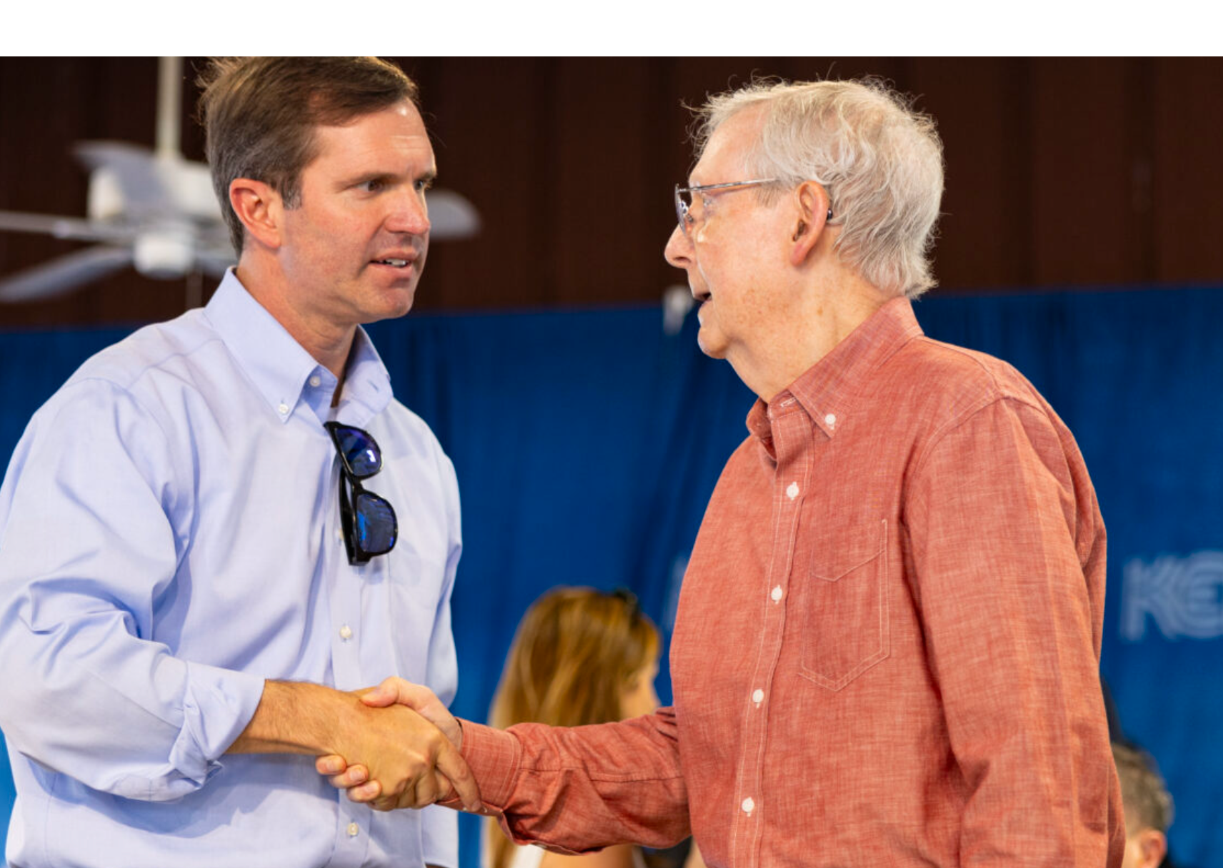 Governor Andy Beshear shakes hands with Senator Mitch McConnell during the 143rd Fancy Farm Picnic on Saturday, Aug. 5, 2023. (Kentucky Lantern photo by Austin Anthony)