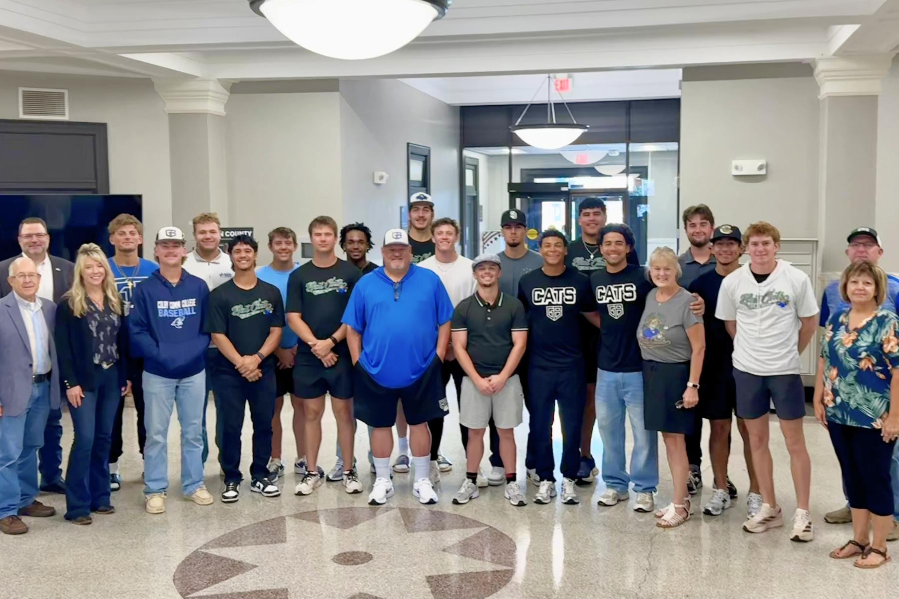 Members of the Great Bend Bat Cats Baseball club are pictured with the Barton County Commission after the adoption of Proclamation 2026-10, recognizing 10 years of baseball, community pride, and affordable family entertainment in Barton County.