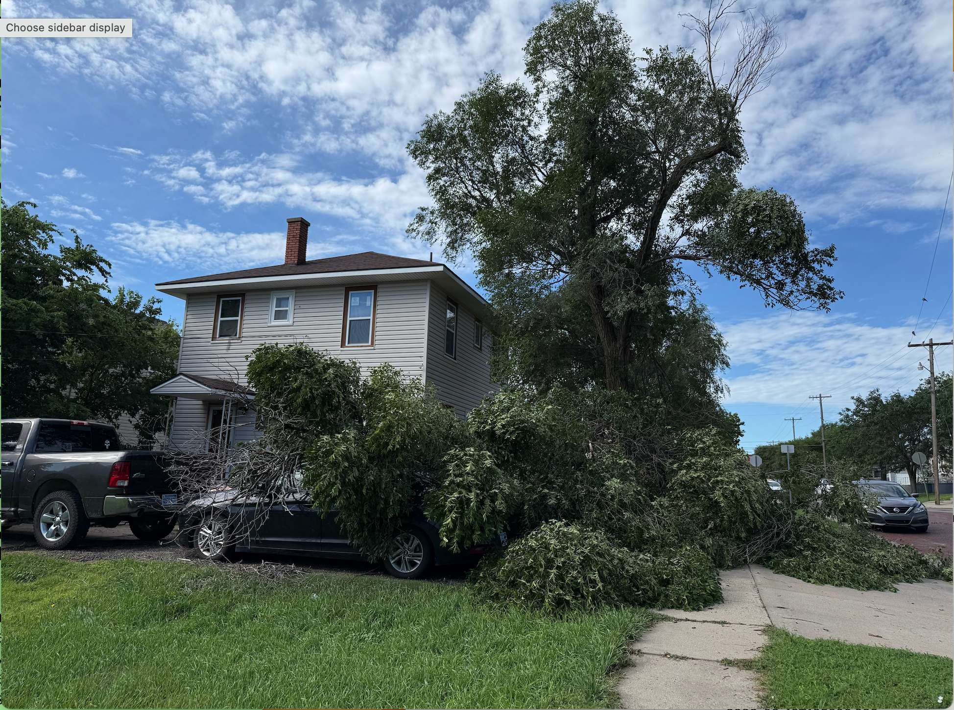 A portion of a tree was blown down during Thursday night's storm off of&nbsp; West 17th Street in Hays. Photo by Cristina Janney/Hays Post