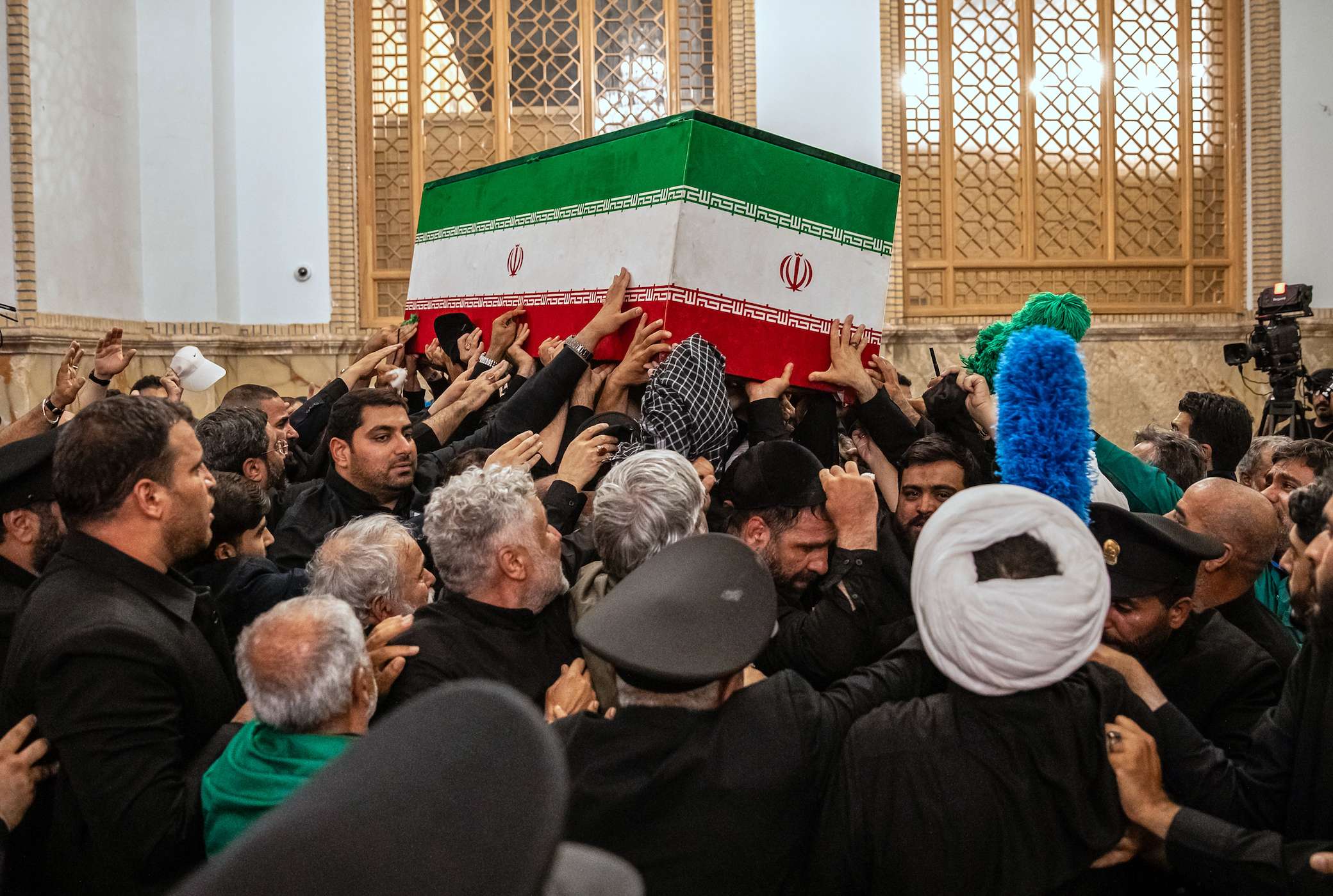 In this photo released by Iran's Supreme Leader's office, mourners carry the coffin of the late Iranian Supreme Leader Ayatollah Ali Khamenei above the crowd for the final prayer before his burial at the Imam Reza Shrine in Mashhad, northeastern Iran, Thursday, July 9, 2026. (Office of the Iranian Supreme Leader via AP)