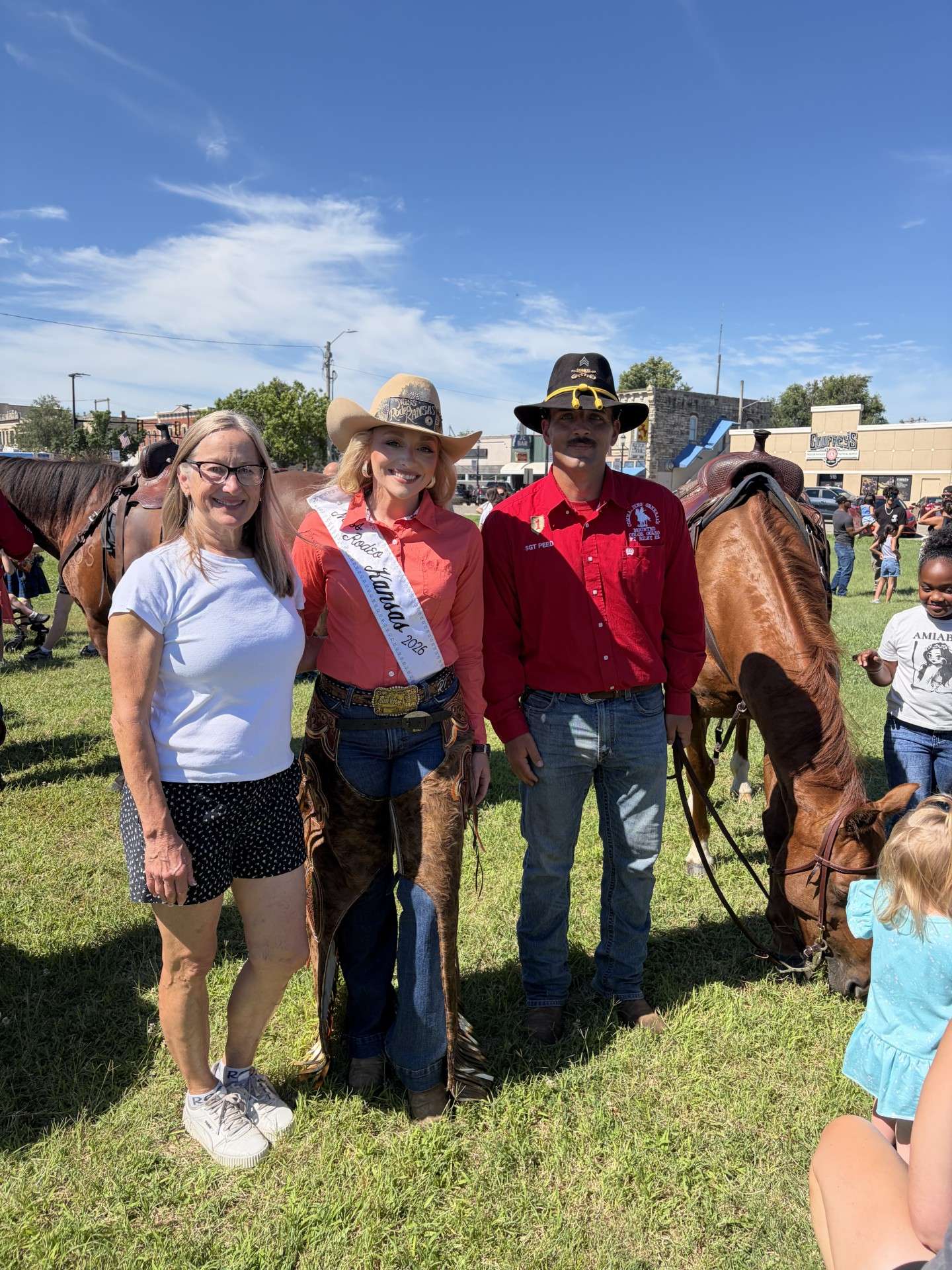 Junction City Mayor Terry Butler, Miss Rodeo Kansas (Rebecca Thornton), and Staff Sgt. Curtis Coonrod