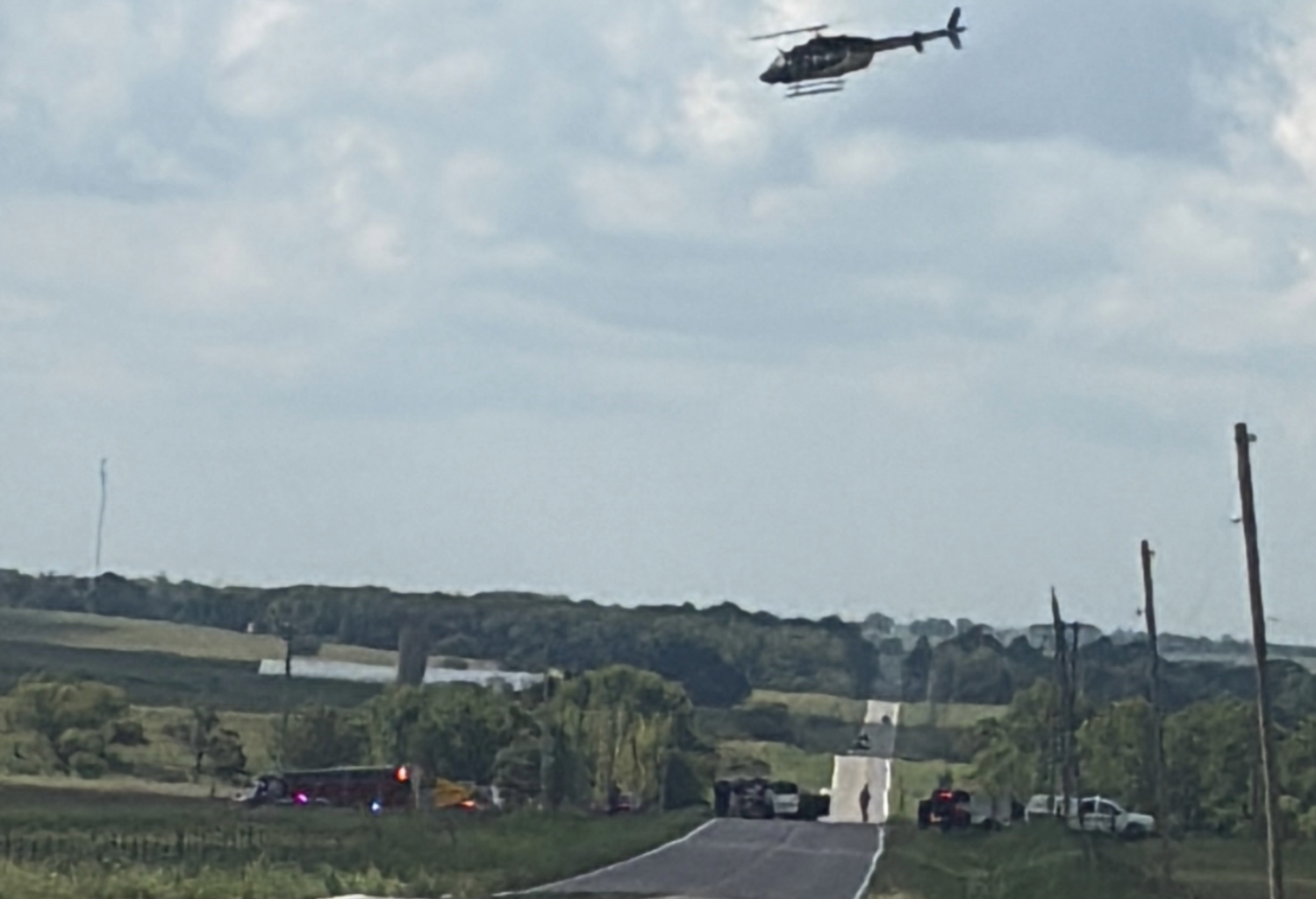 A medical helicopter leaves the scene of a reported injury crash near Kansas Highway 99 and Lyon County Road 40 on Sunday. photo by Chuck Samples courtesy KVOE 