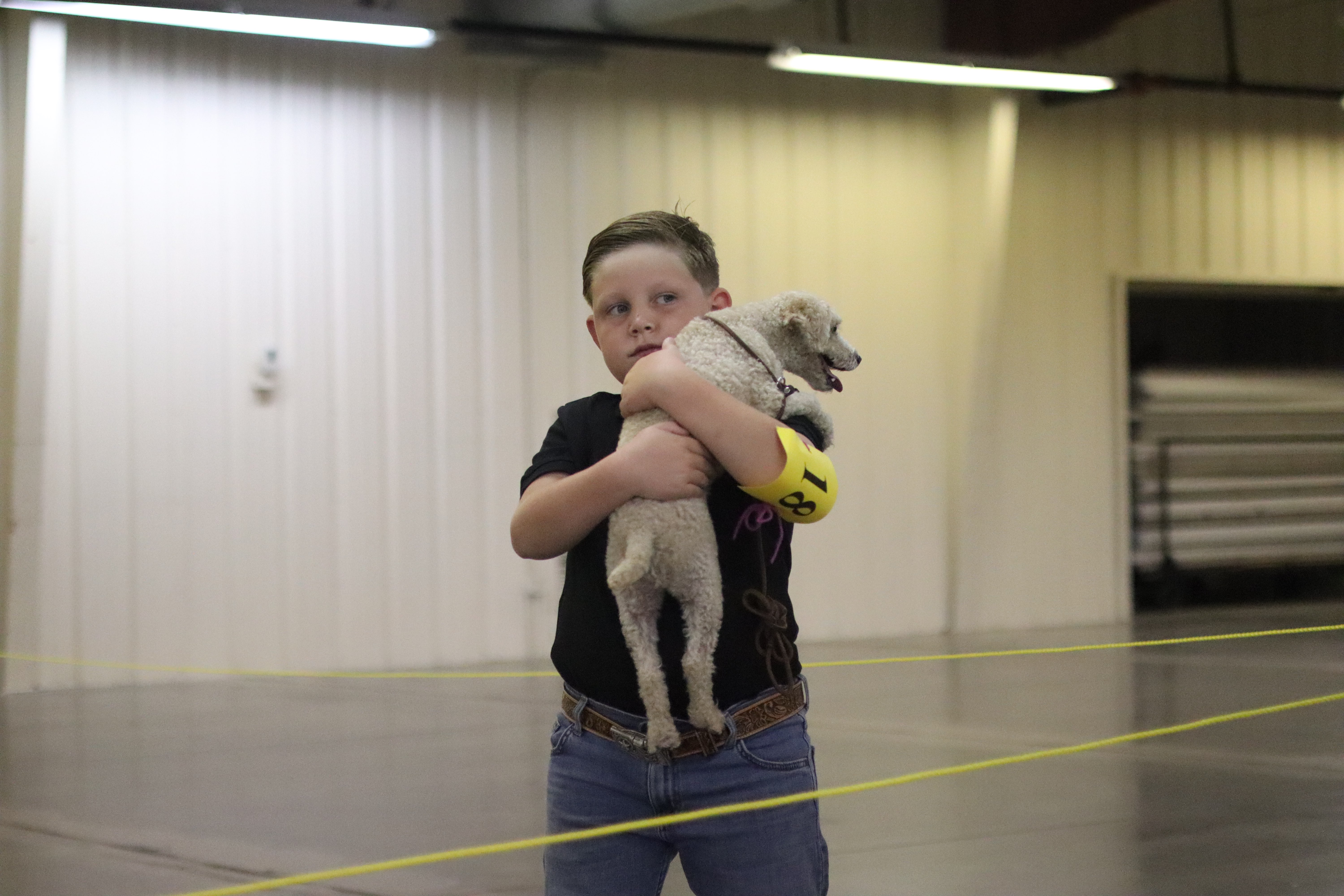 Reddin holding Bingo after the showmanship competition. Photo by Alin Hett/Hays Post.&nbsp;