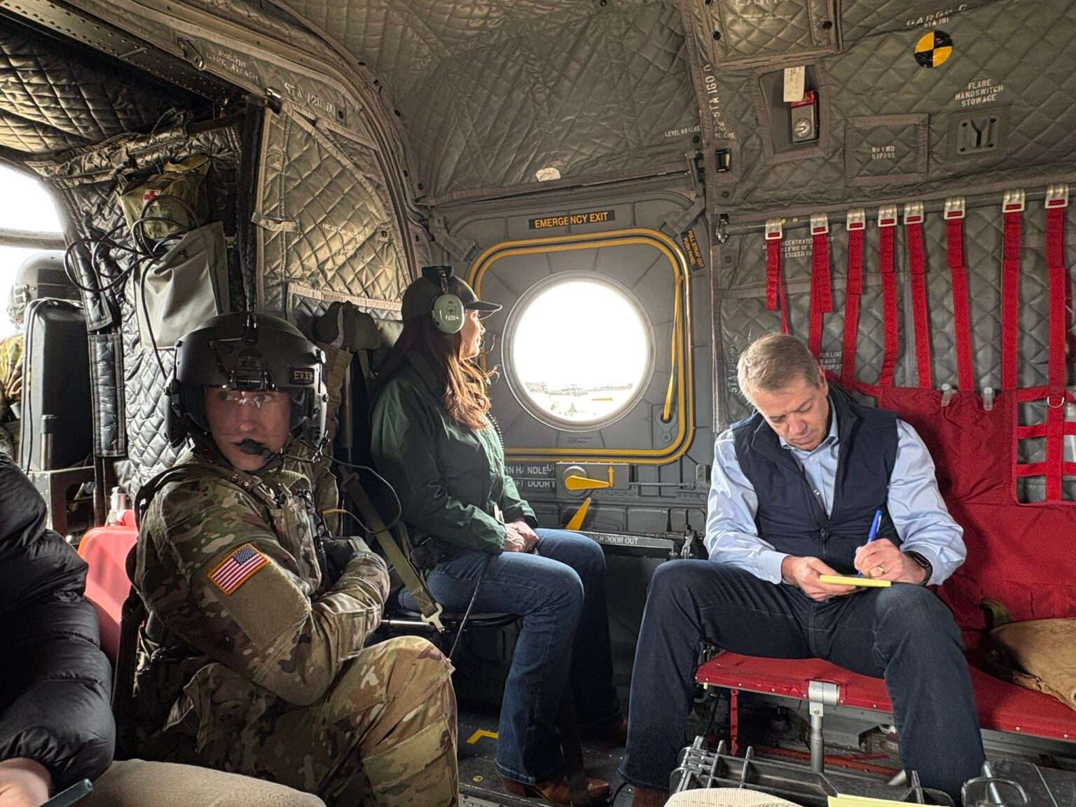 Nebraska Gov. Jim Pillen, right, and U.S. Secretary of Agriculture Brooke Rollins, center, survey wildfire damage over Nebraska on March 23, 2026. (Photo courtesy of the Nebraska Governor’s Office)