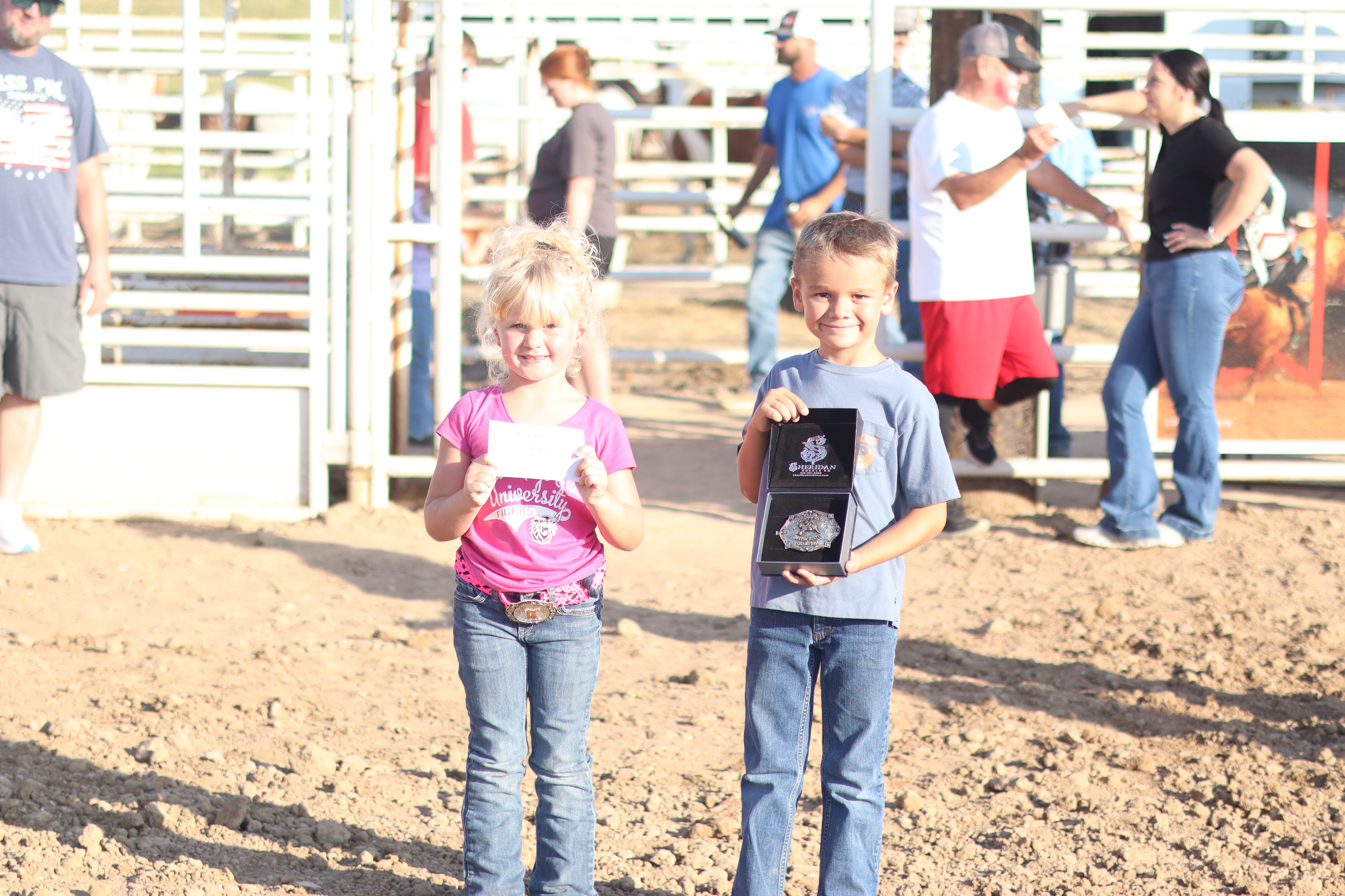 Kennedy Patzner, left, won 2nd place and a $20 gift card, and Hudson Basgall, right, won 1st place in the Mutton Bustin' competition and won a belt buckle. &nbsp;