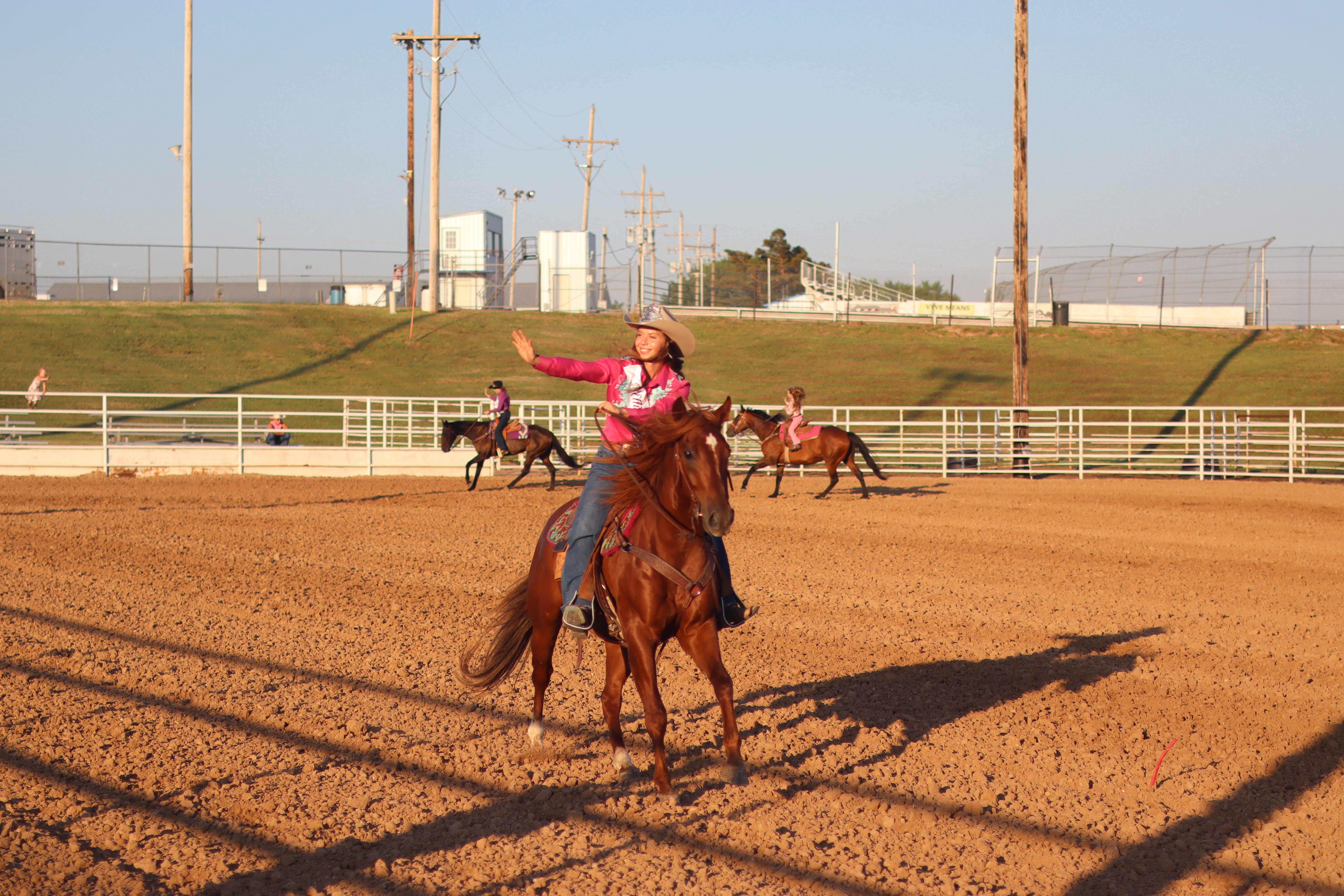 Miss Ellis County Queen, Candence Koch rides around the arena after winning Queen.&nbsp;
