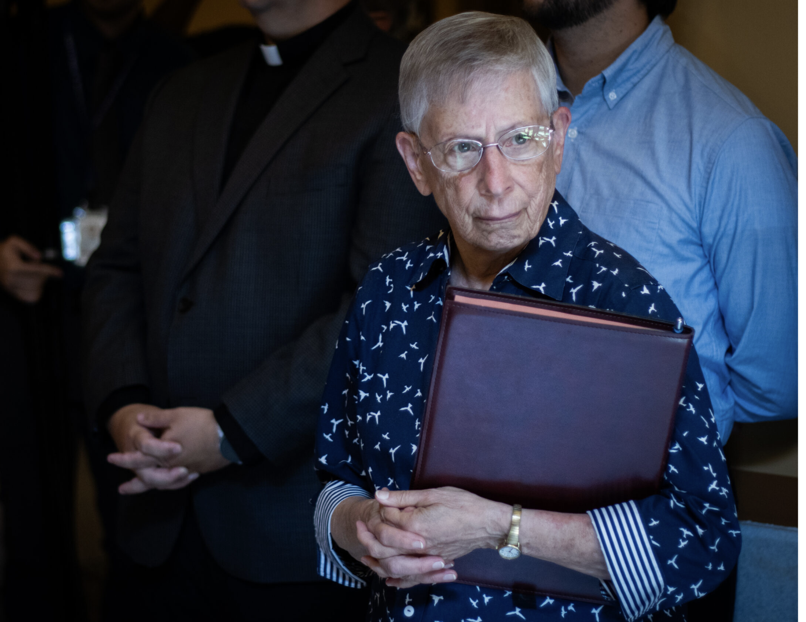 Therese Bangert, a sister of the Sisters of Charity of Leavenworth, joins Kansas faith leaders in delivering a letter to the Governor’s Office urging the governor to commute the sentences of state death row inmates at the Statehouse in Topeka on July 14, 2026. (Photo by Baya Burgess/ Kansas Reflector)
