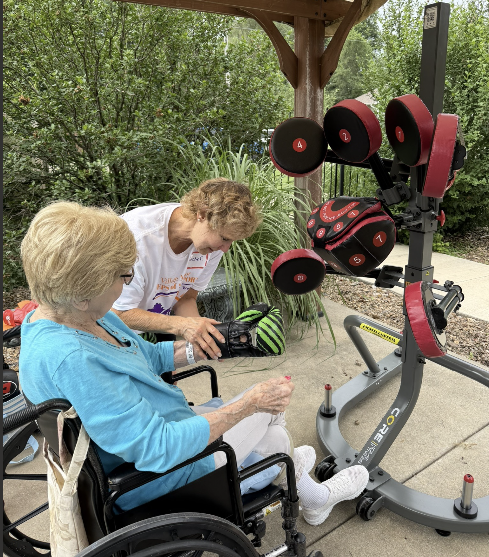 Village Manor (Abilene, KS) resident getting assistance to get set up with the&nbsp;BlazePod™ interactive therapy system -&nbsp;Photo provided by Memorial Health System