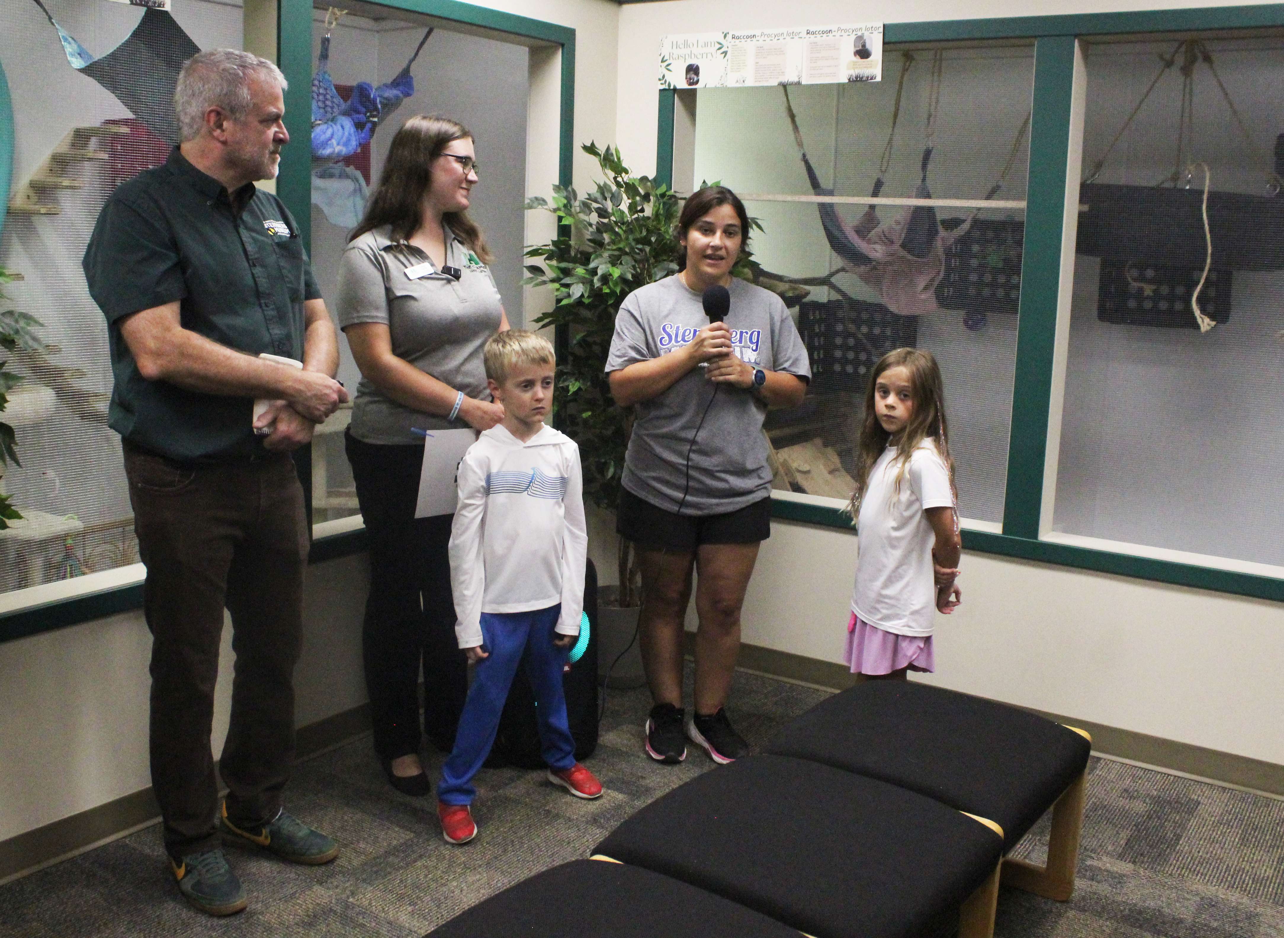 From left: Sternberg Executive Director Reese Barrick, Leigh Purdy of the Chamber in Hays, and&nbsp;Alicia Gaede, naturalist and education manager, in front of the new mammal habitats at the museum. Photo by Cristina Janney/Hays Post