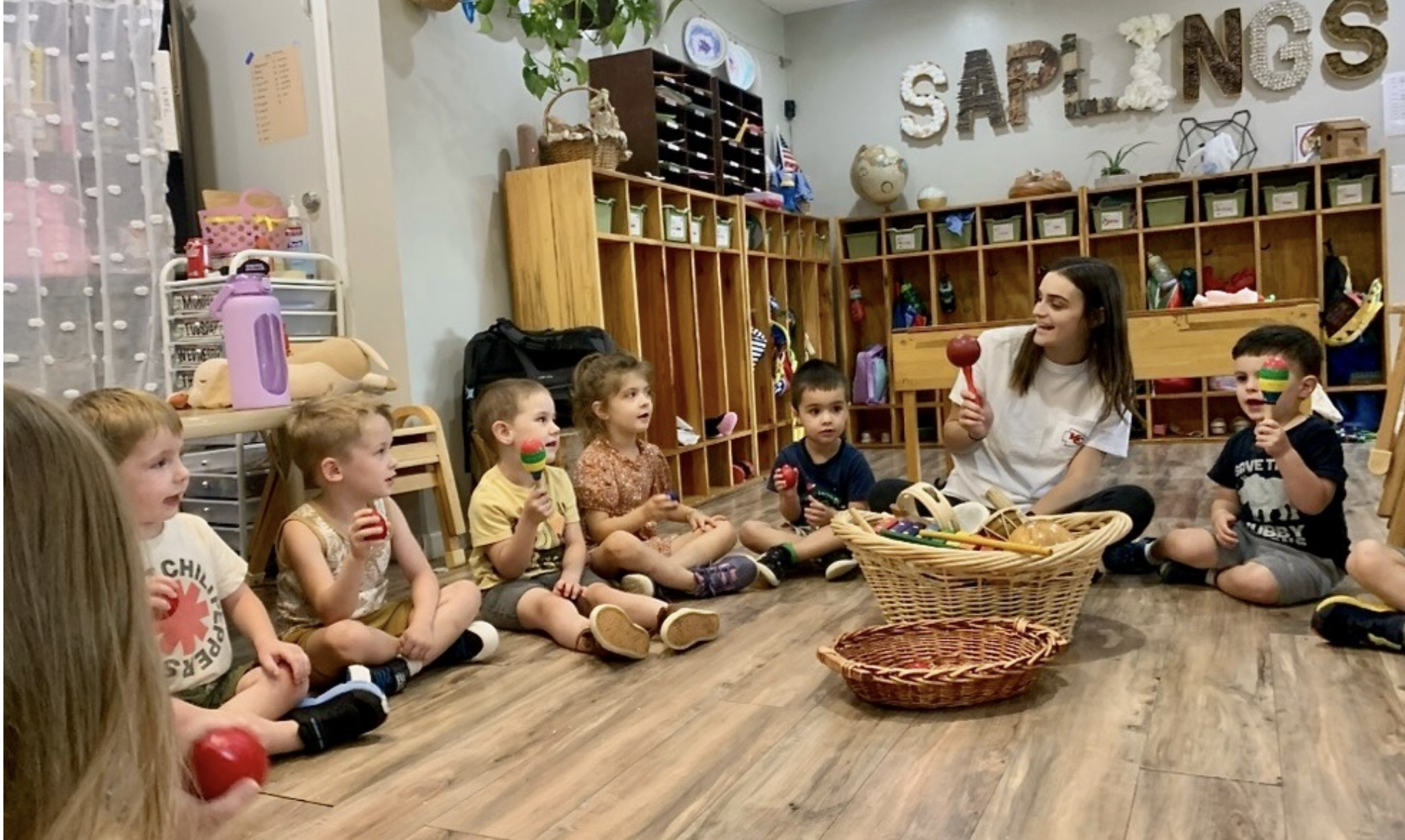 Kailie Crews leads a music activity at Peapod Learning Center in Springfield, which participates in the state's childcare subsidy program. The Department of Elementary and Secondary Education indicated it will not pay providers based on enrollment as previously planned (photo submitted).