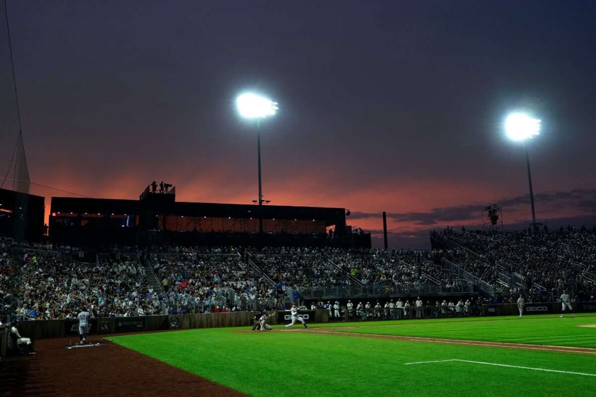 FILE - The New York Yankees play the Chicago White Sox during a baseball game in Dyersville, Iowa, Aug. 12, 2021. (AP Photo/Charlie Neibergall)