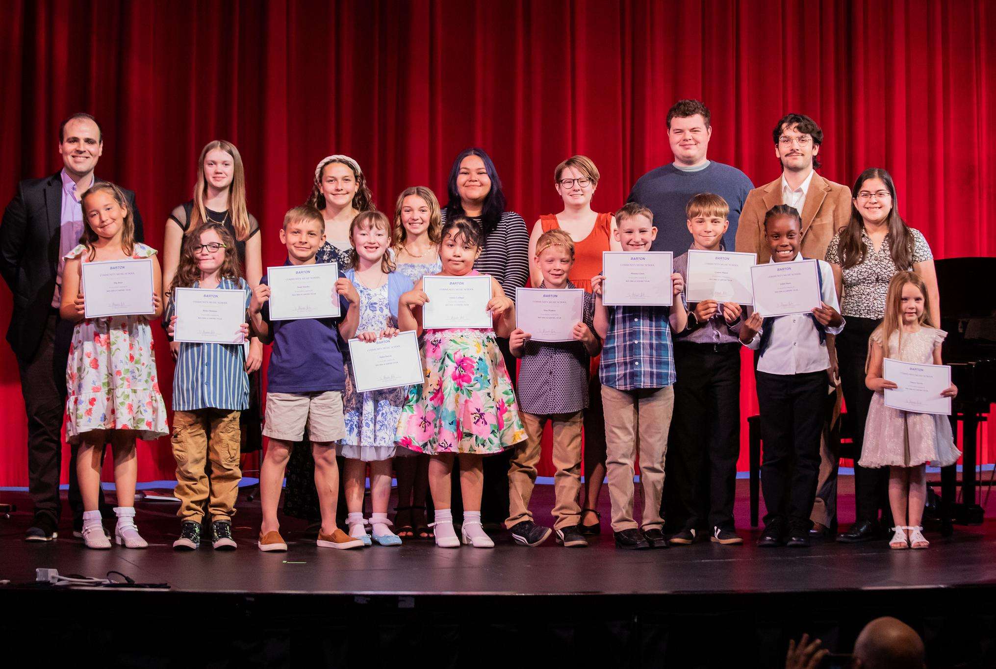 Barton Community School students pose for a photo at in the Fine Arts Auditorium after their recital at the end of the spring semester. (photo by Barton Communications)