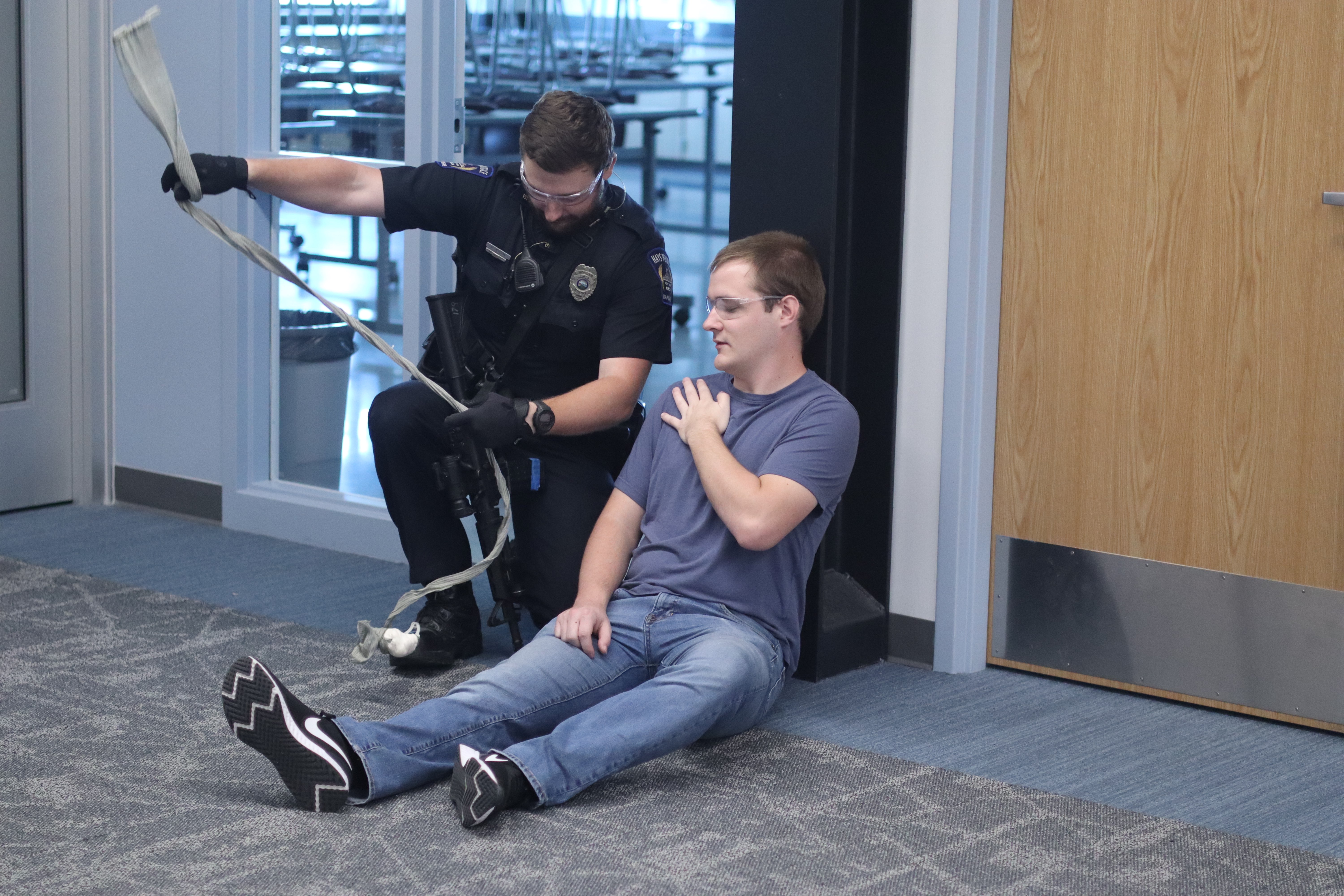 Hays Police Department officers train alongside simulated victims and actors during an active shooter exercise at Hays High School.<br>
