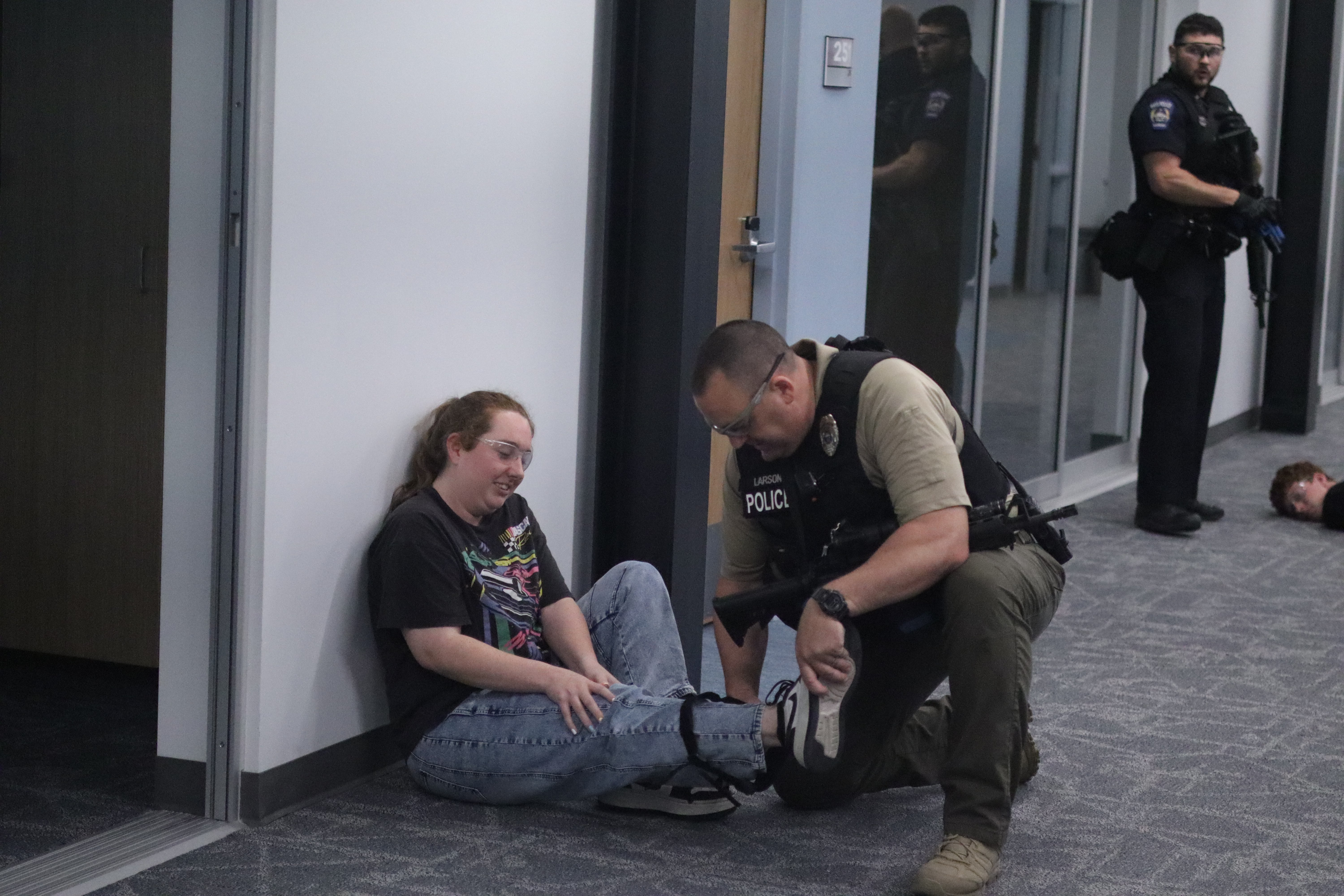 Hays Police Department officers train alongside simulated victims and actors during an active shooter exercise at Hays High School.<br>